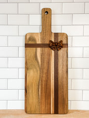 rectangle acacia wood cheese board with a bow on it at the rustic barn in Killingworth ct