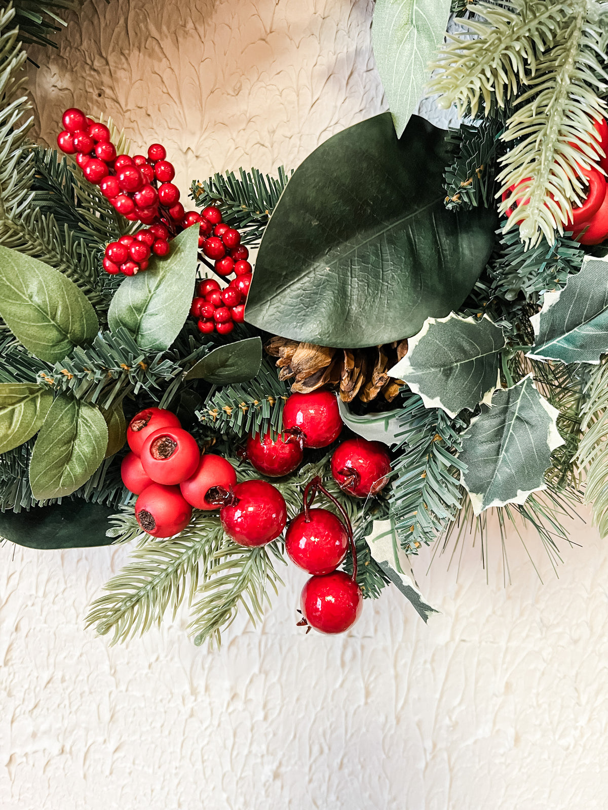 red berry holly and pine christmas wreath at the rustic barn in killingworth ct