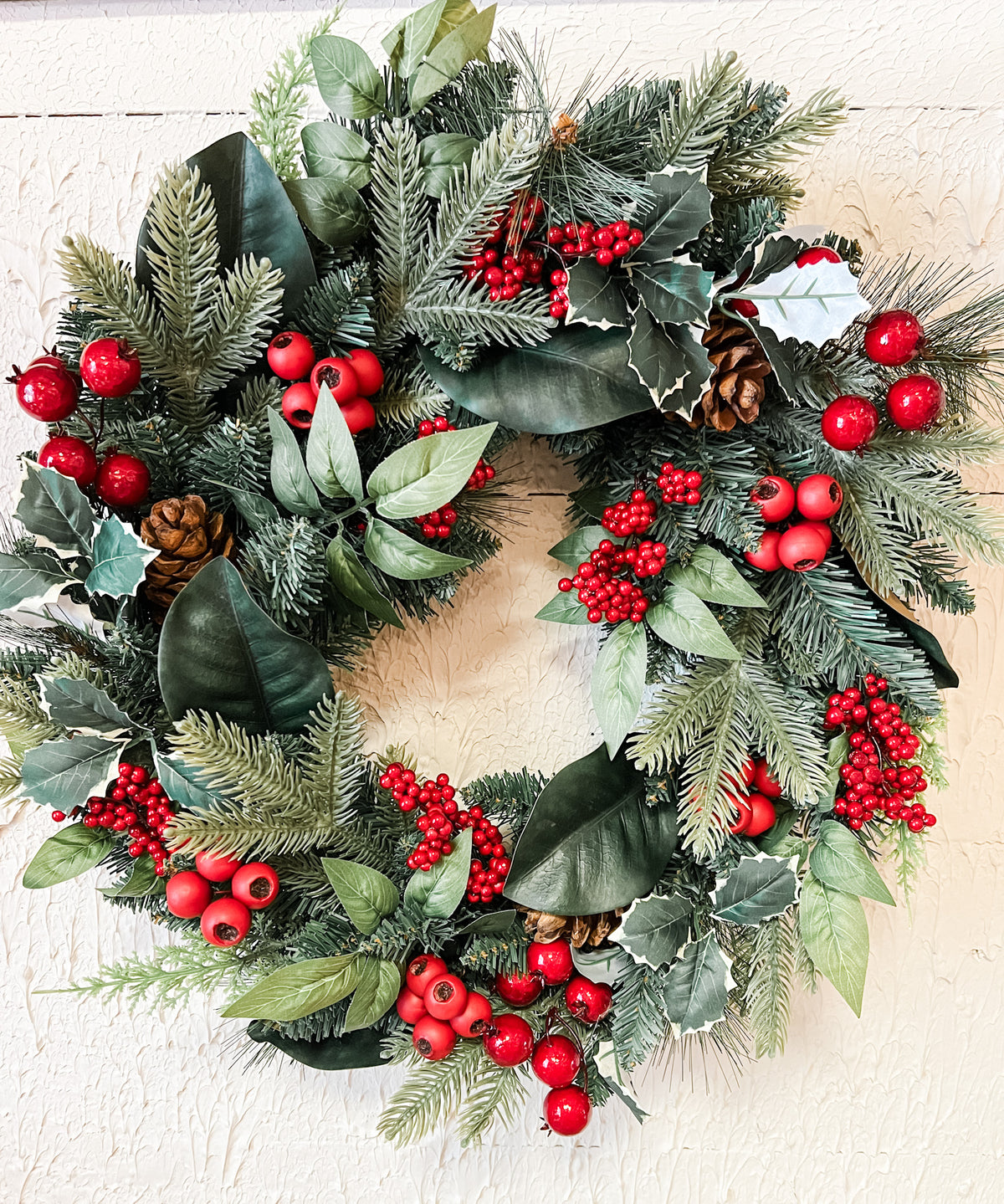 red berry holly and pine christmas wreath at the rustic barn in killingworth ct