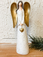 resin angel with heart and gold wings at the rustic barn in killingworth ct