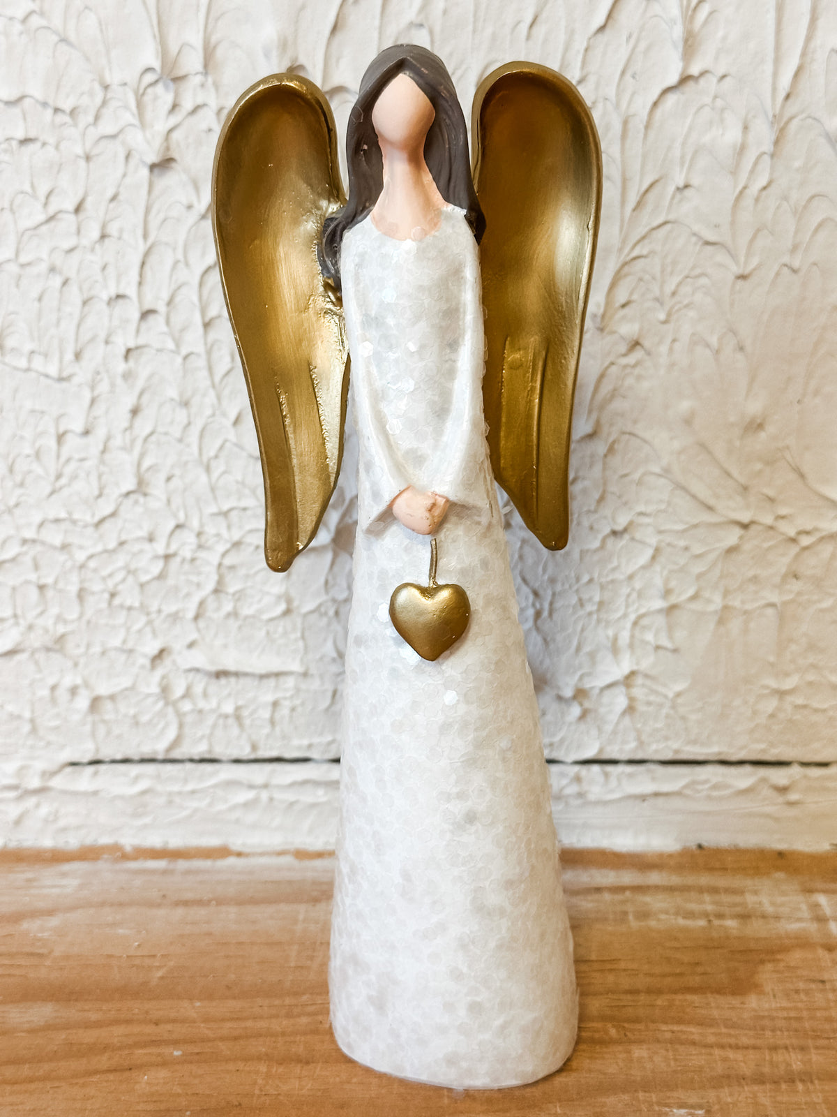 resin angel with heart and gold wings at the rustic barn in killingworth ct