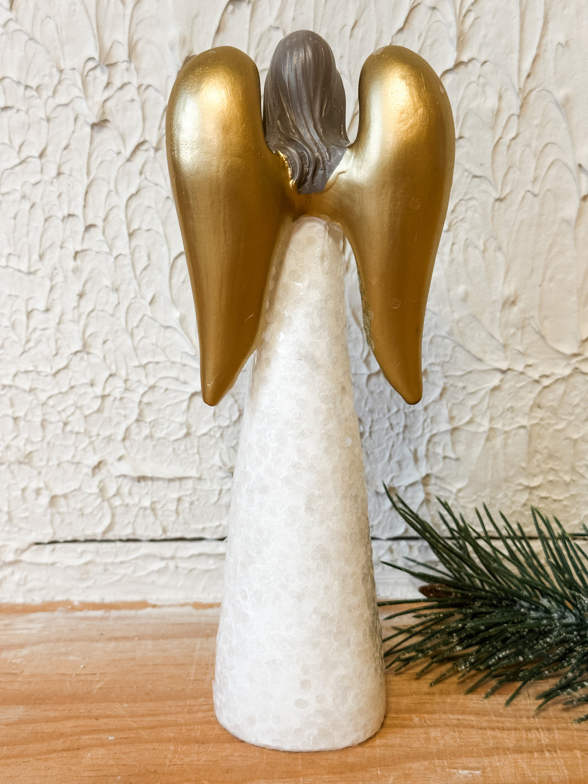 resin angel with heart and gold wings at the rustic barn in killingworth ct