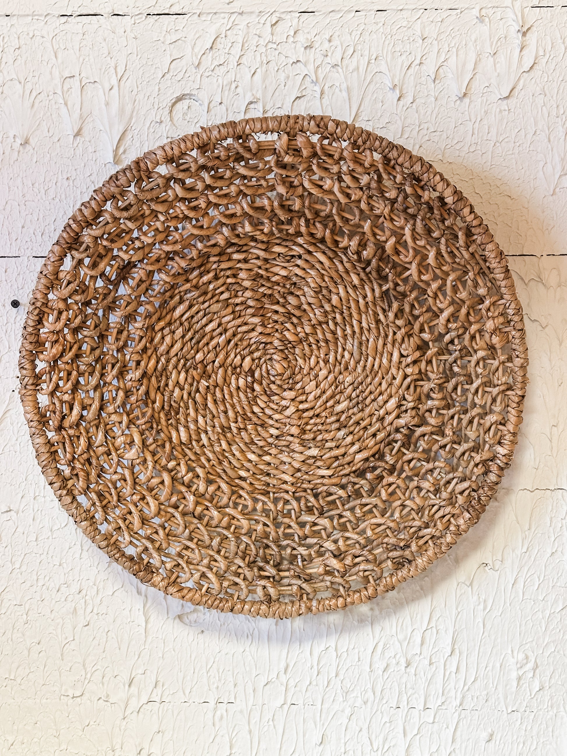 18-1/4” round natural woven rattan wall decor at The Rustic Barn in Killingworth CT