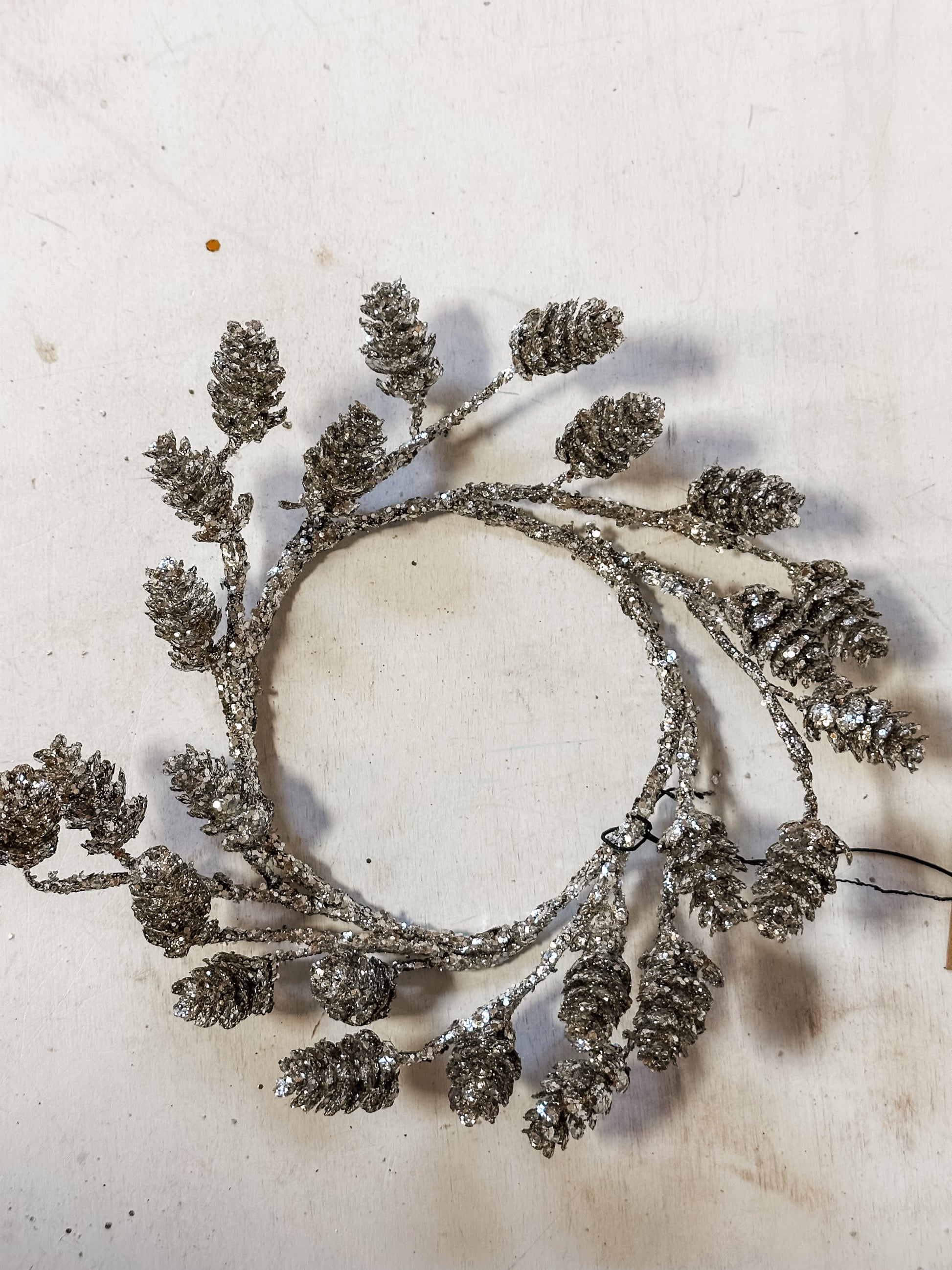 round plastic pinecone wreath with glitter at The Rustic Barn in Killingworth CT