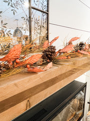 rustic orange pine and natural pinecone fall garland at the rustic barn in killingworth ct