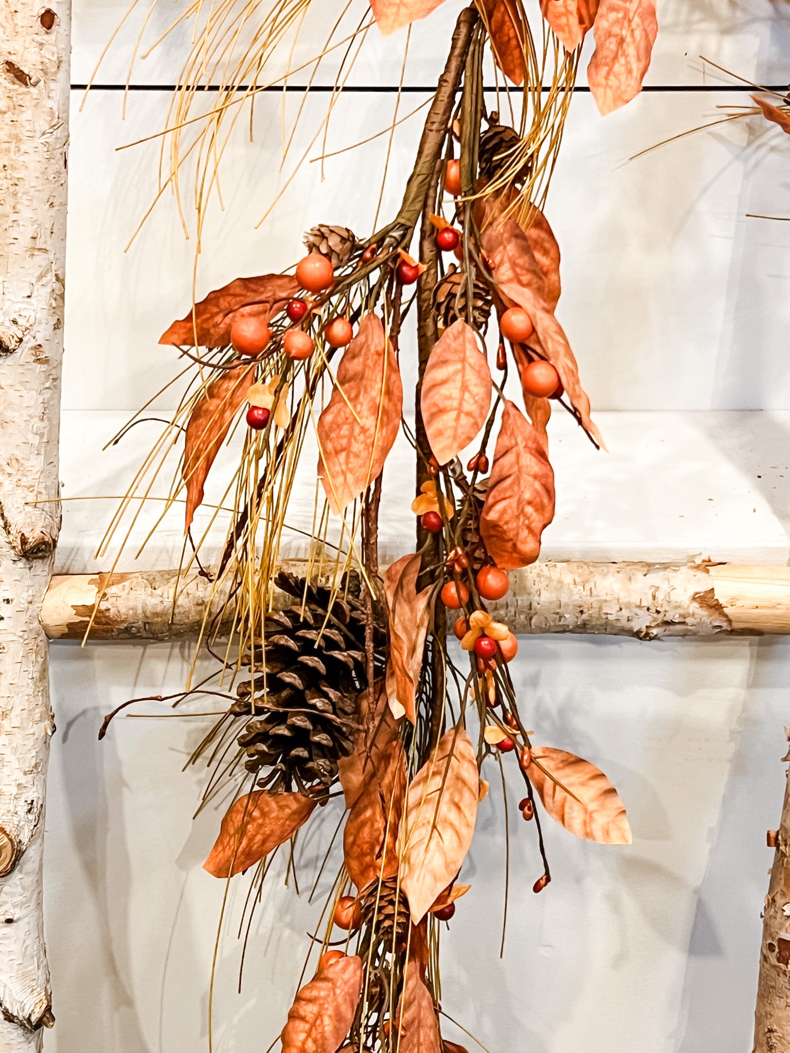 rustic orange pine and natural pinecone fall garland at the rustic barn in killingworth ct