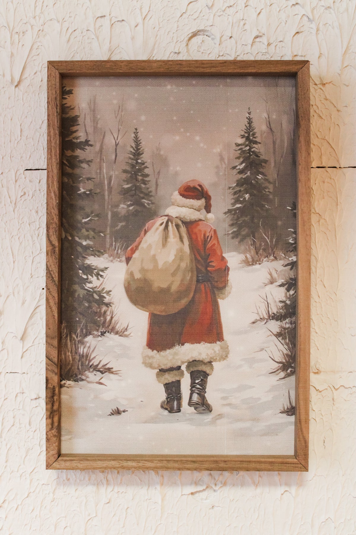 Santa walking through to delivery presents in the snowy scene on a walking journey 10x16 size for christmas wall decor for sale at the rustic barn in killingworth, CT