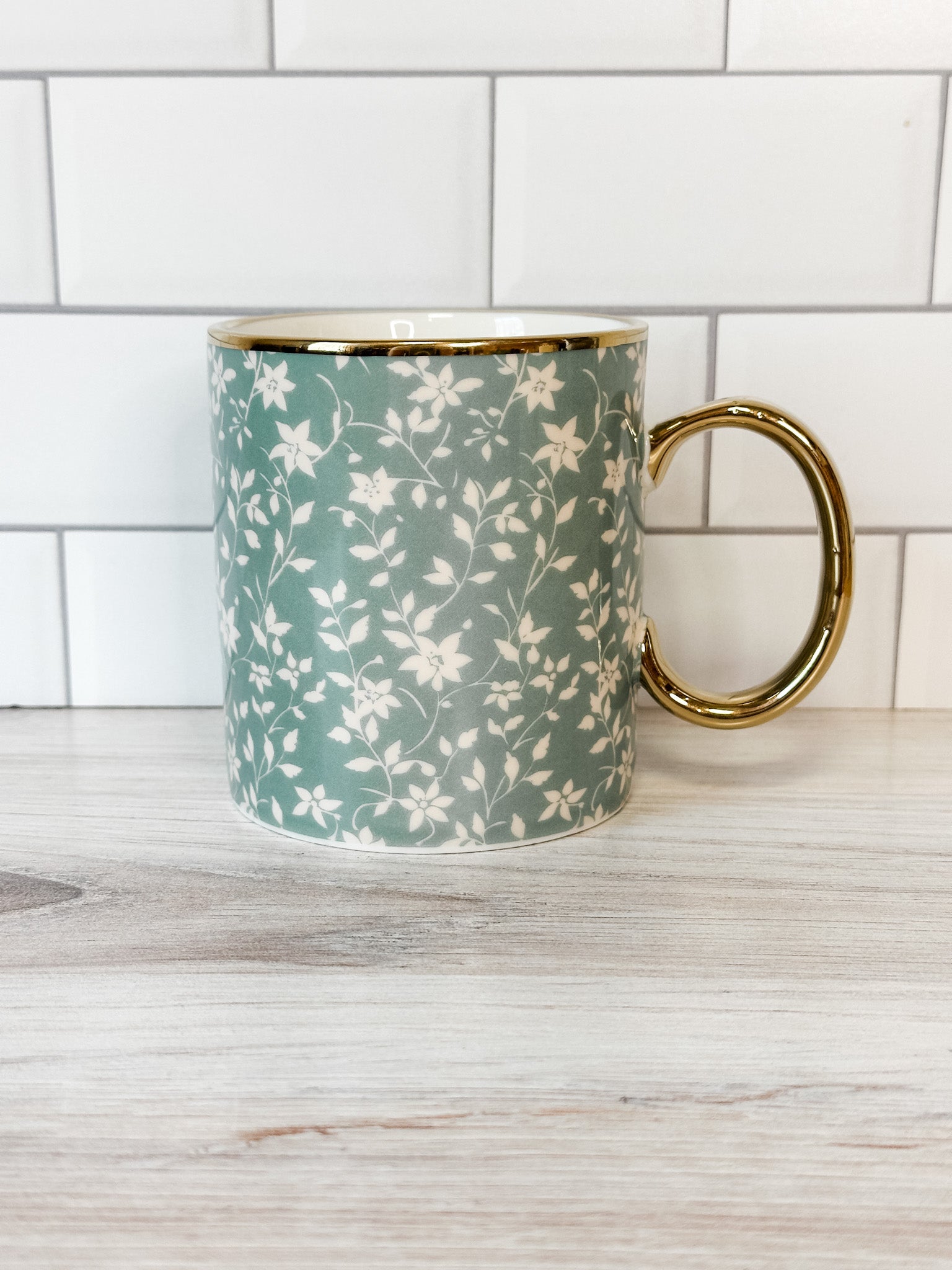 white floral mug with gold handle at the rustic barn in killingworth ct