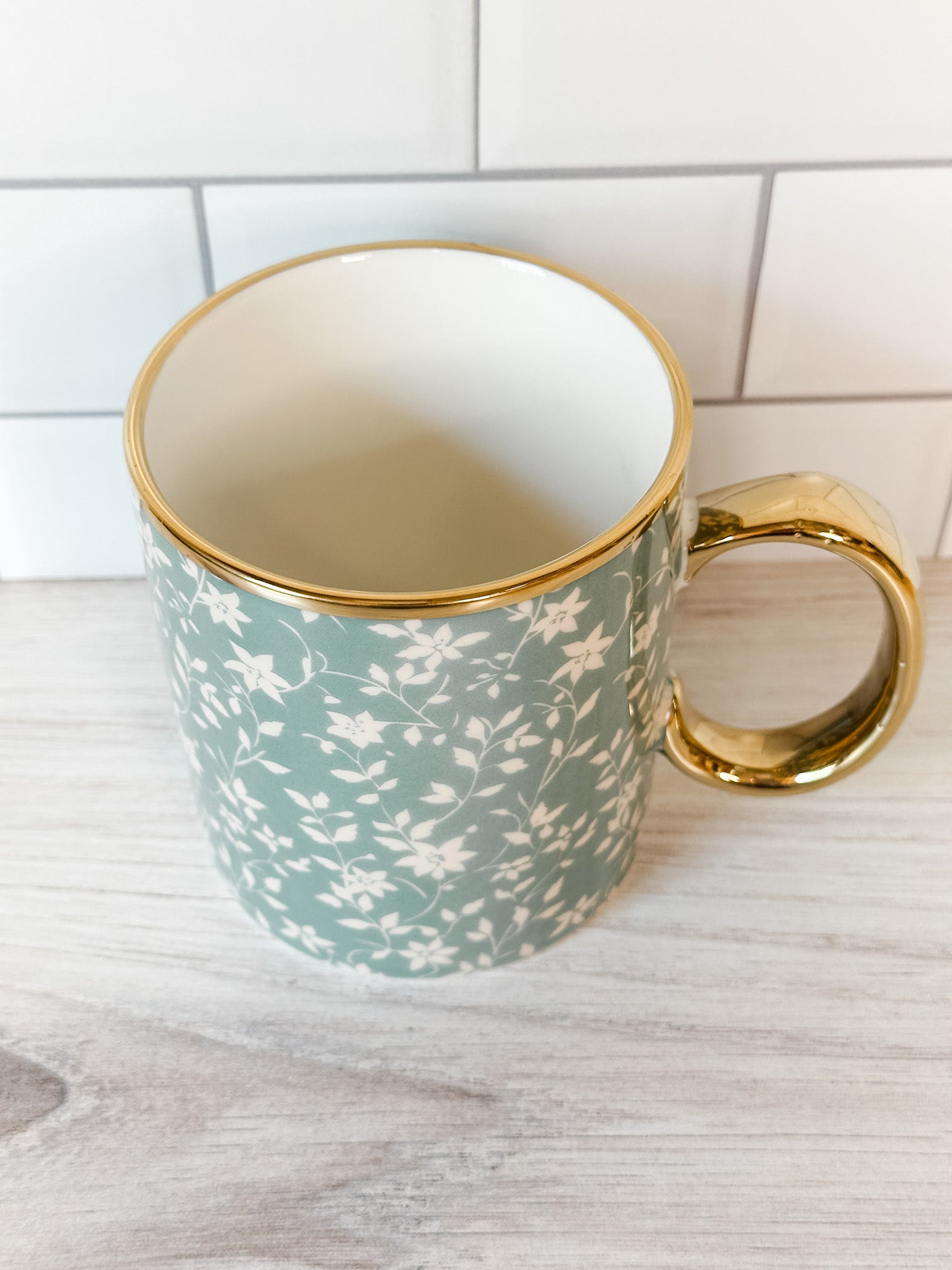 white floral mug with gold handle at the rustic barn in killingworth ct