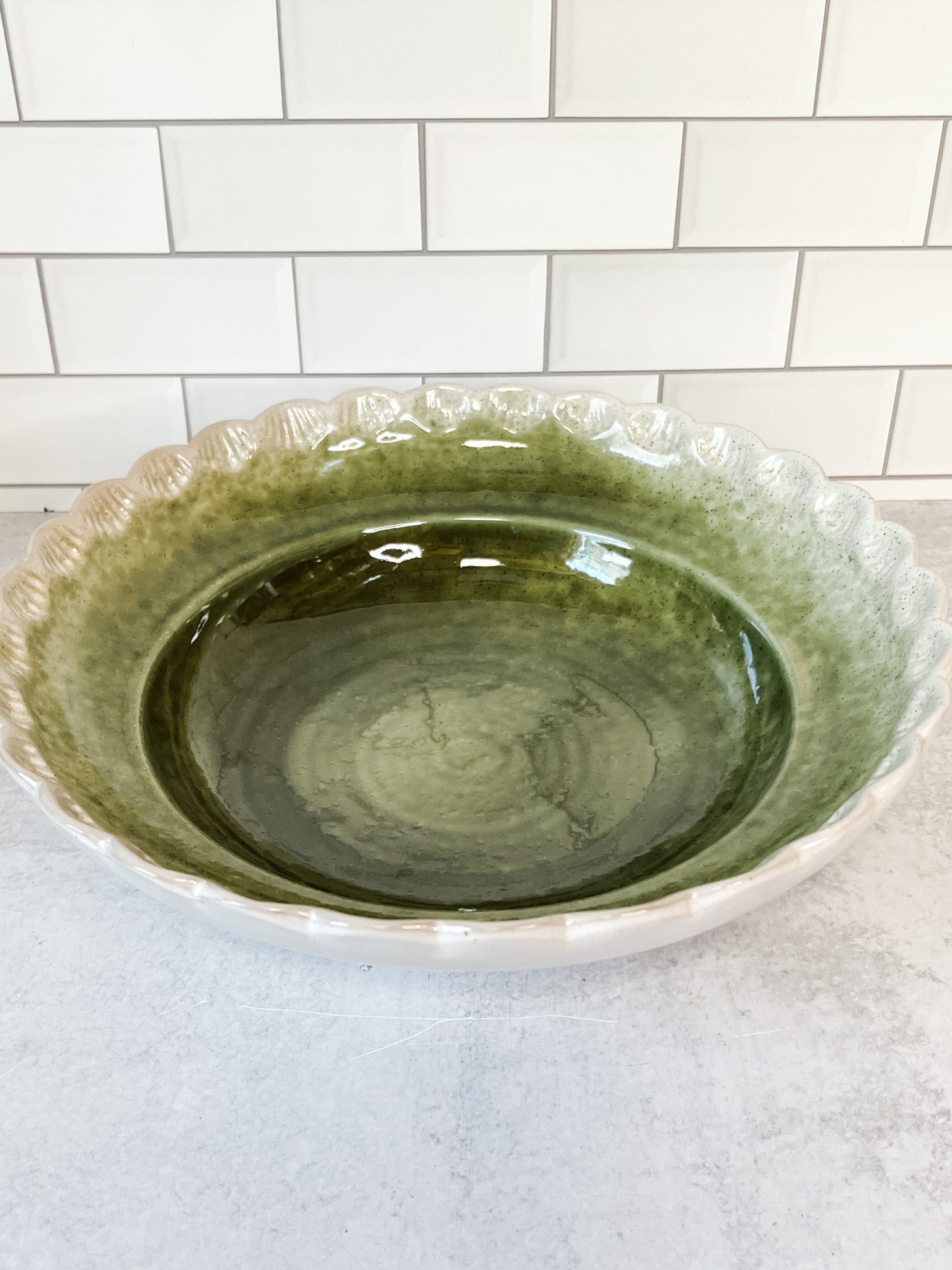 scalloped green stoneware serving bowl at the rustic barn in killingworth ct
