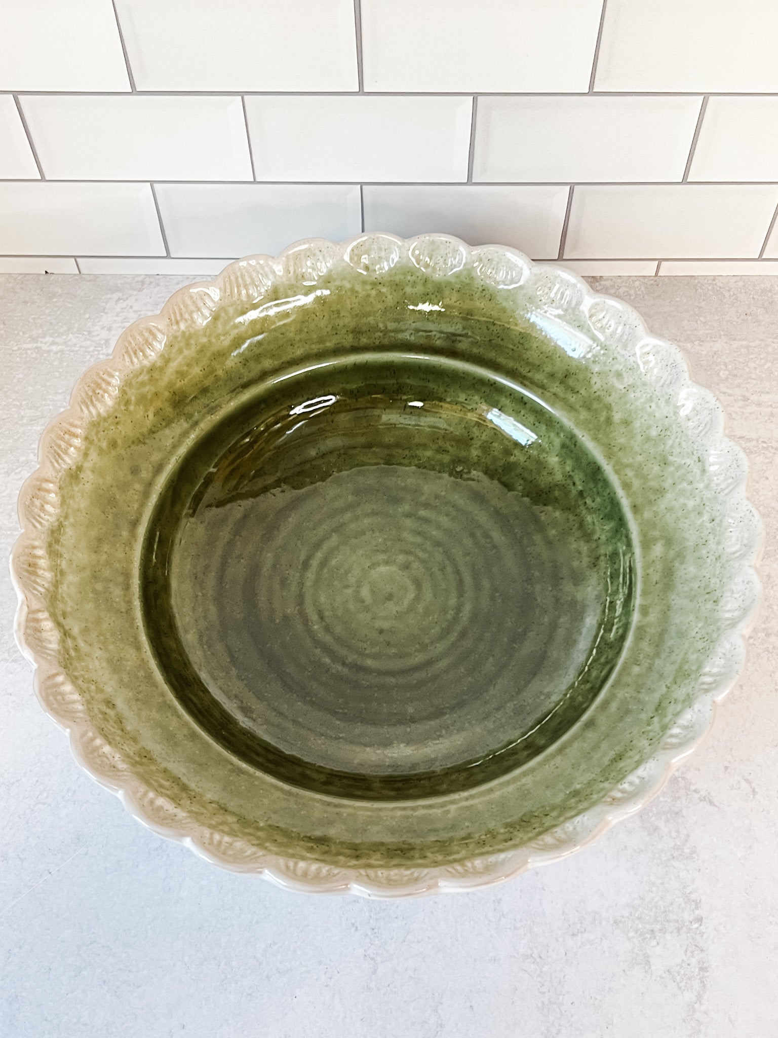 scalloped green stoneware serving bowl at the rustic barn in killingworth ct