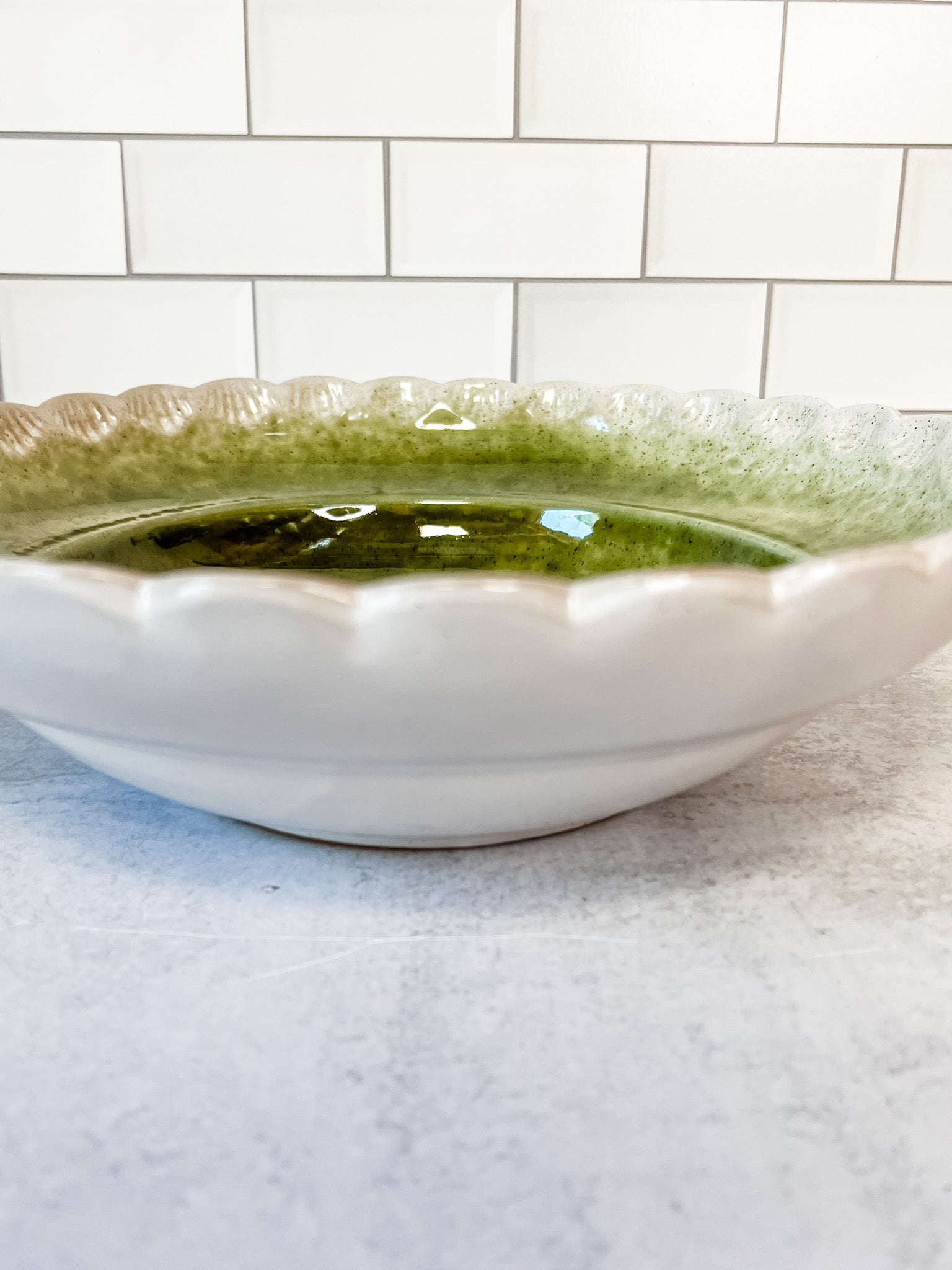 scalloped green stoneware serving bowl at the rustic barn in killingworth ct