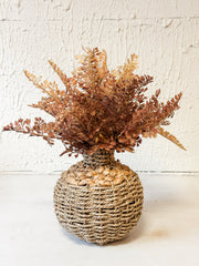 small seagrass woven vase with faux florals at the Rustic Barn in Killingworth CT