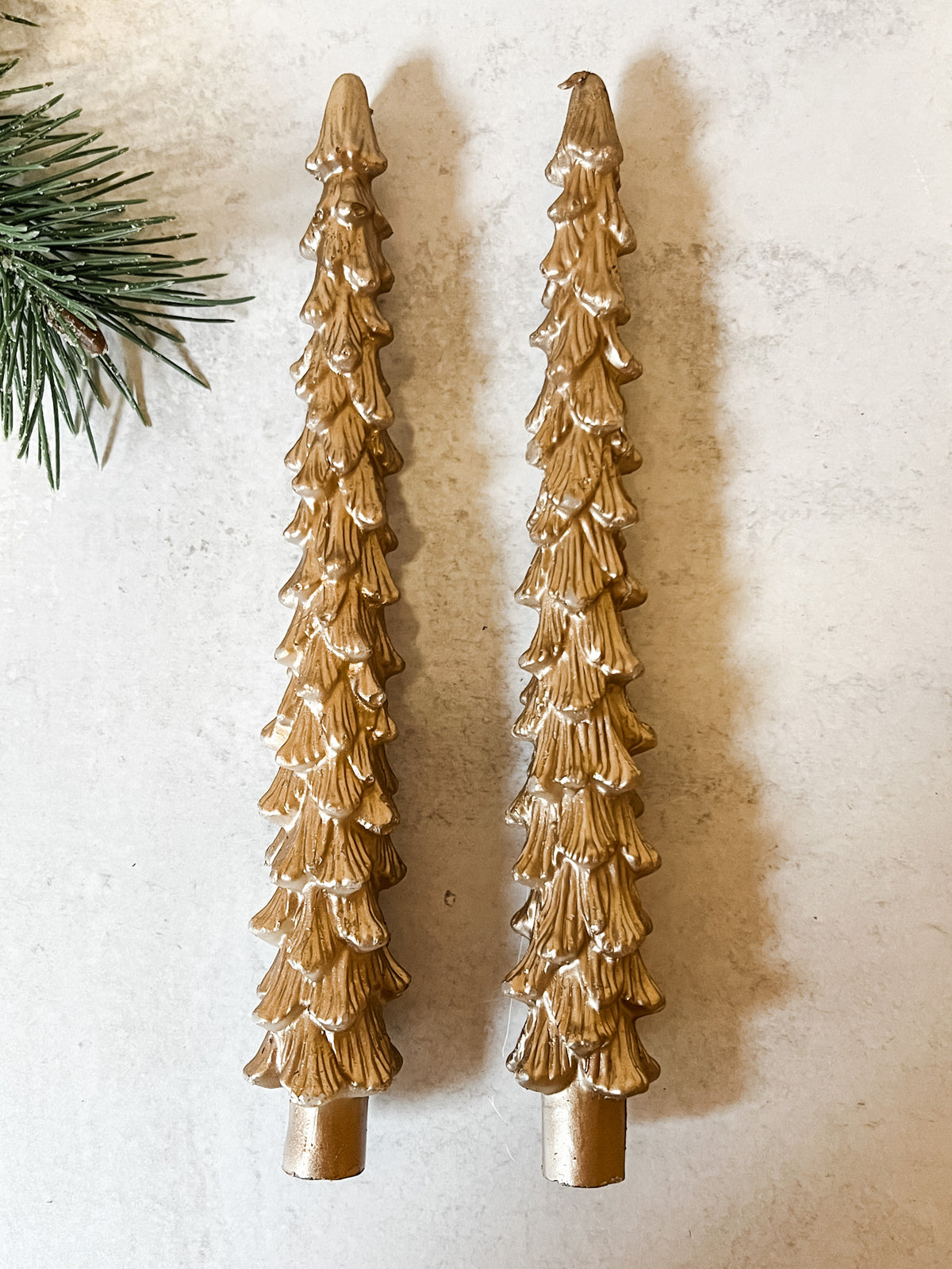 set of two gold tree shaped taper candles at the rustic barn in killingworth ct