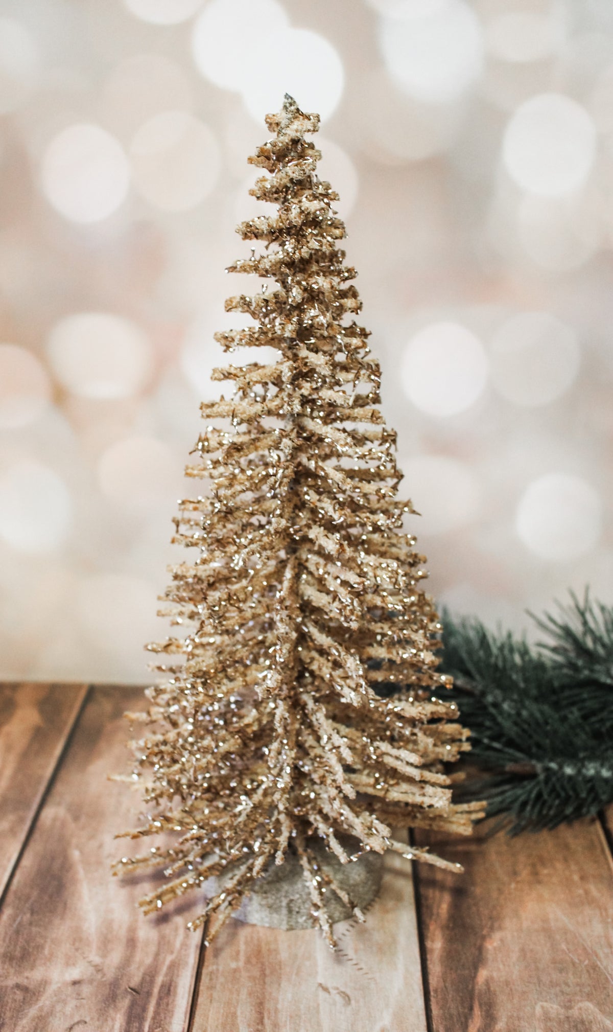 Shimmering natural wood alpine gold sparkly vintage trees for sale at the rustic barn in Killingworth, CT for christmas 