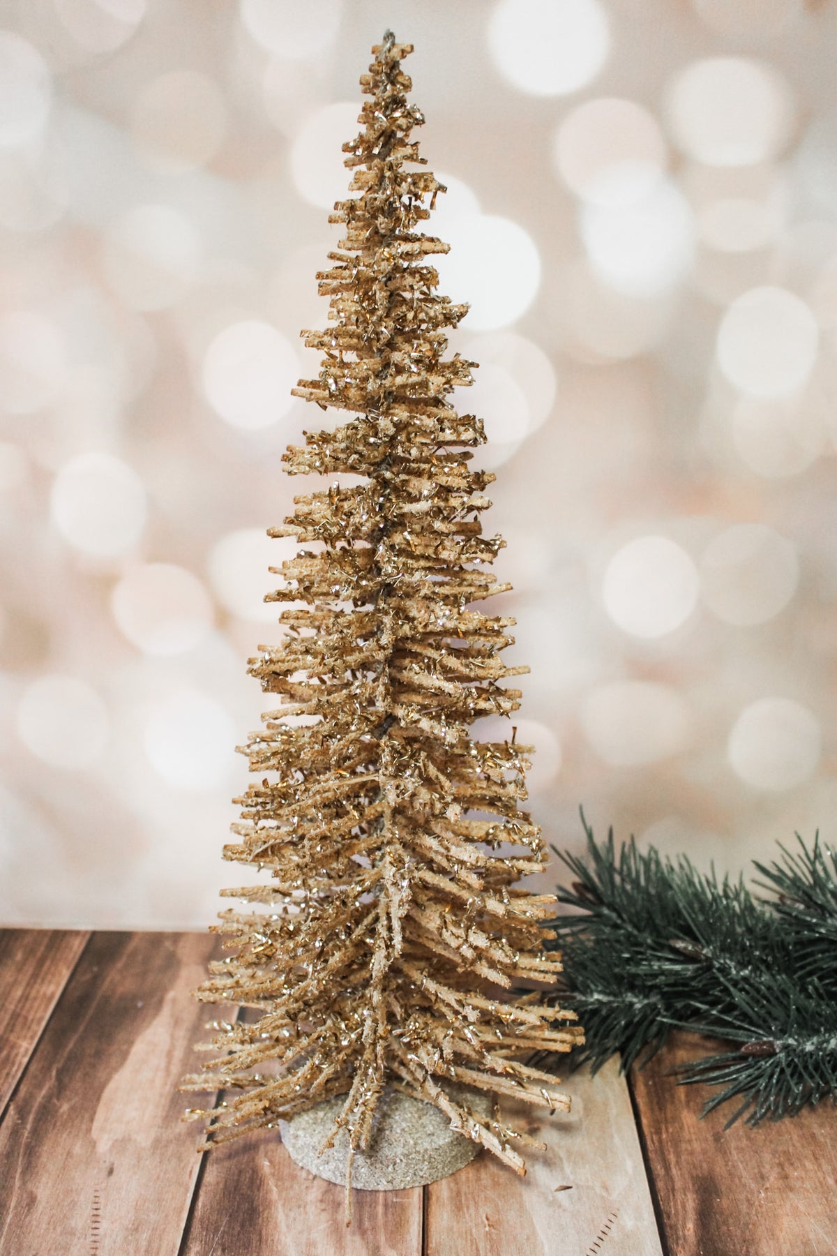 Shimmering natural wood alpine gold sparkly vintage trees for sale at the rustic barn in Killingworth, CT for christmas 