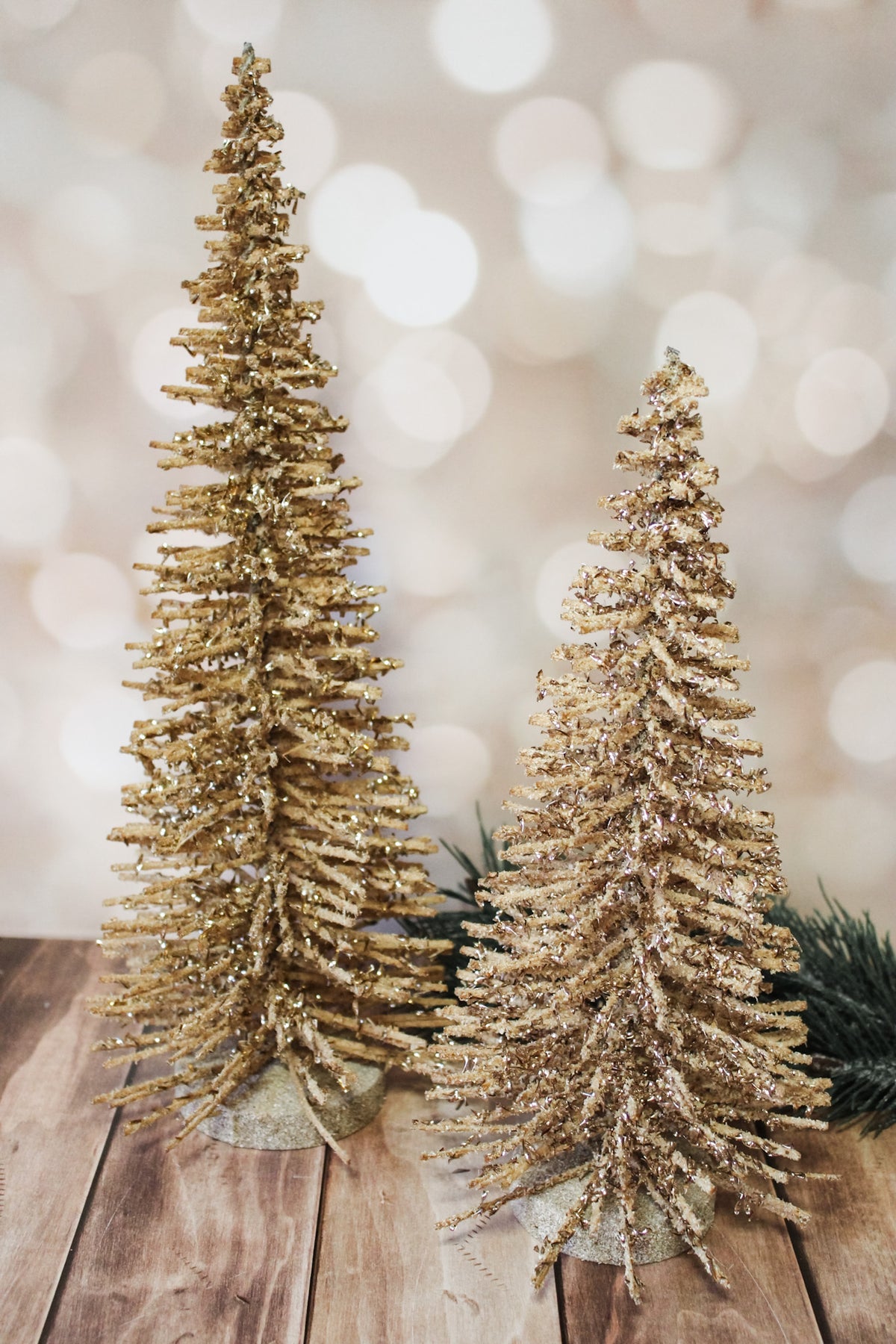 Shimmering natural wood alpine gold sparkly vintage trees for sale at the rustic barn in Killingworth, CT for christmas 