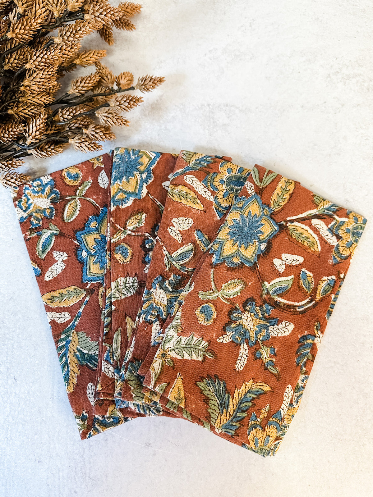 Sienna orange floral printed cotton and linen napkins for sale at the rustic barn in killingworth, CT