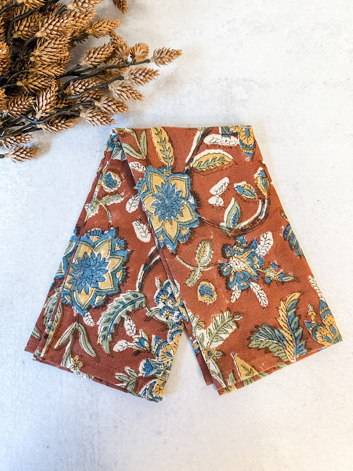Sienna orange floral printed cotton and linen napkins for sale at the rustic barn in killingworth, CT