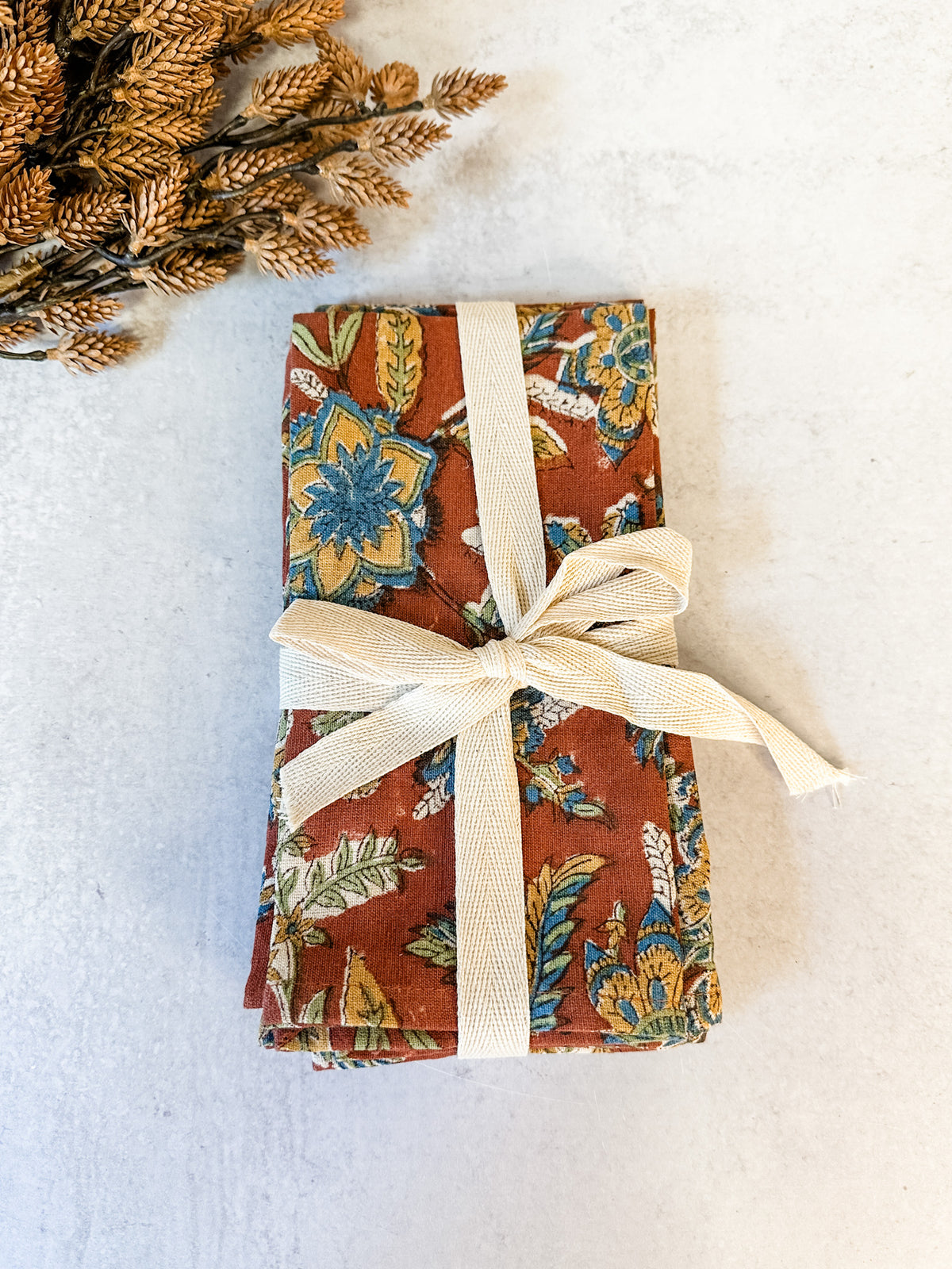 Sienna orange floral printed cotton and linen napkins for sale at the rustic barn in killingworth, CT
