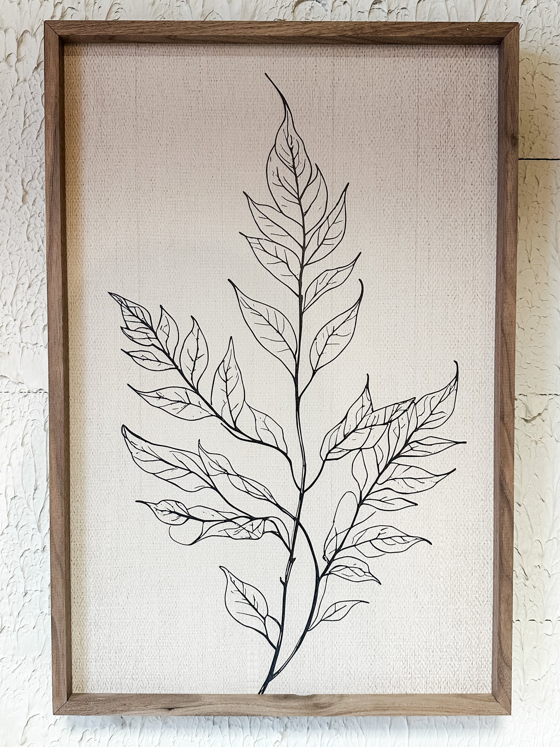 single branch with full leaves wooden wall decor at the Rustic Barn in Killingworth, CT