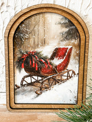 small arched top print of a red sleigh in the winter snow at the rustic barn in killingworth ct