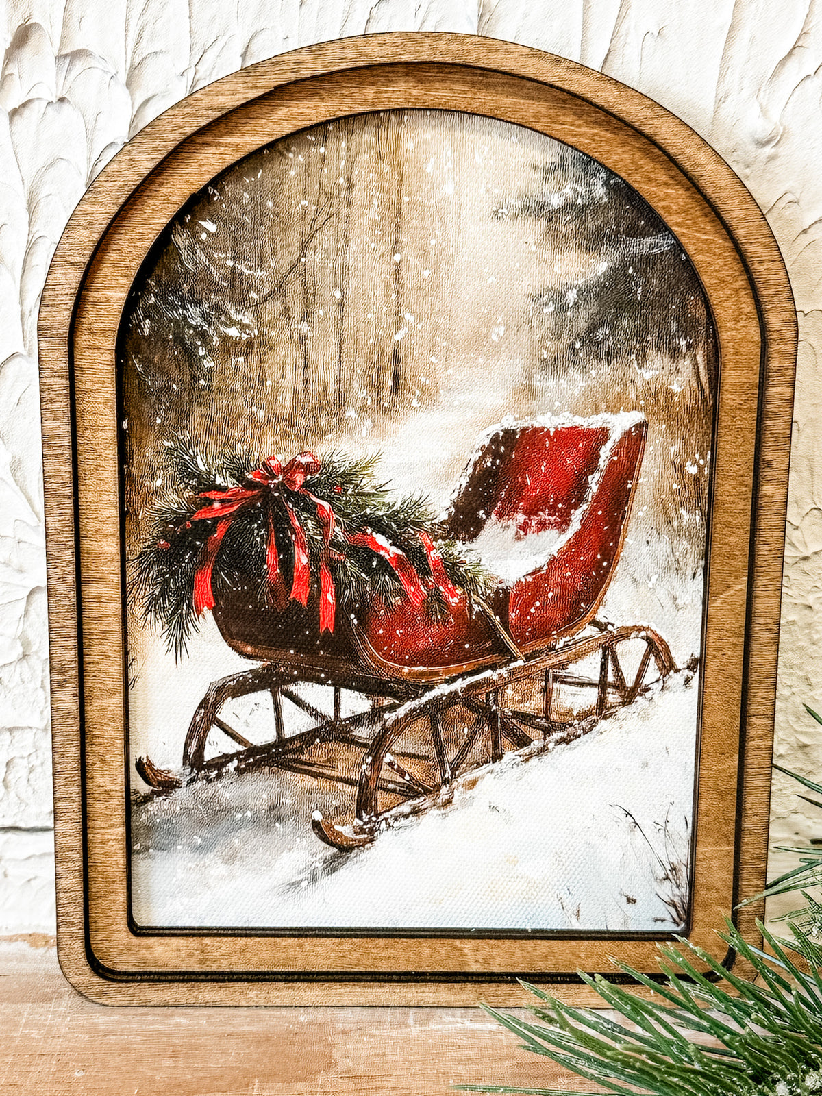 small arched top print of a red sleigh in the winter snow at the rustic barn in killingworth ct
