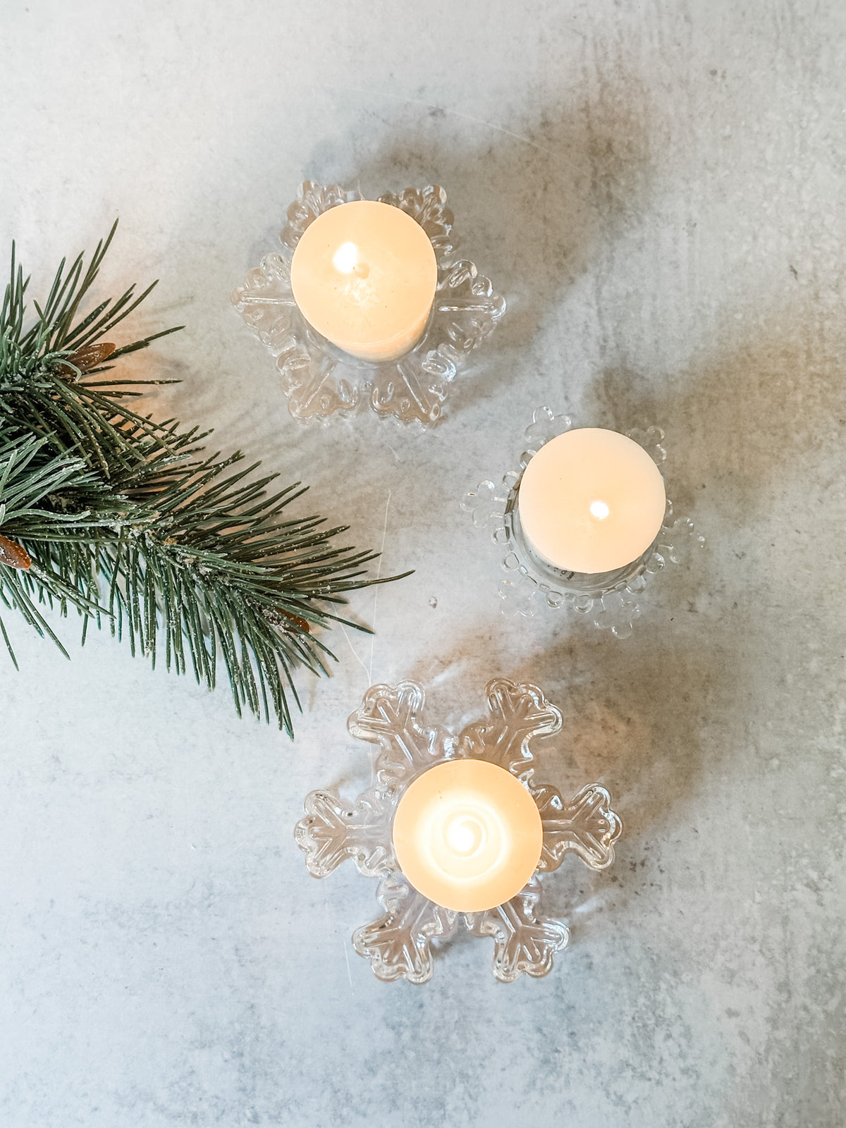small glass snowflake shaped tealight holders at the rustic barn in killingworth ct