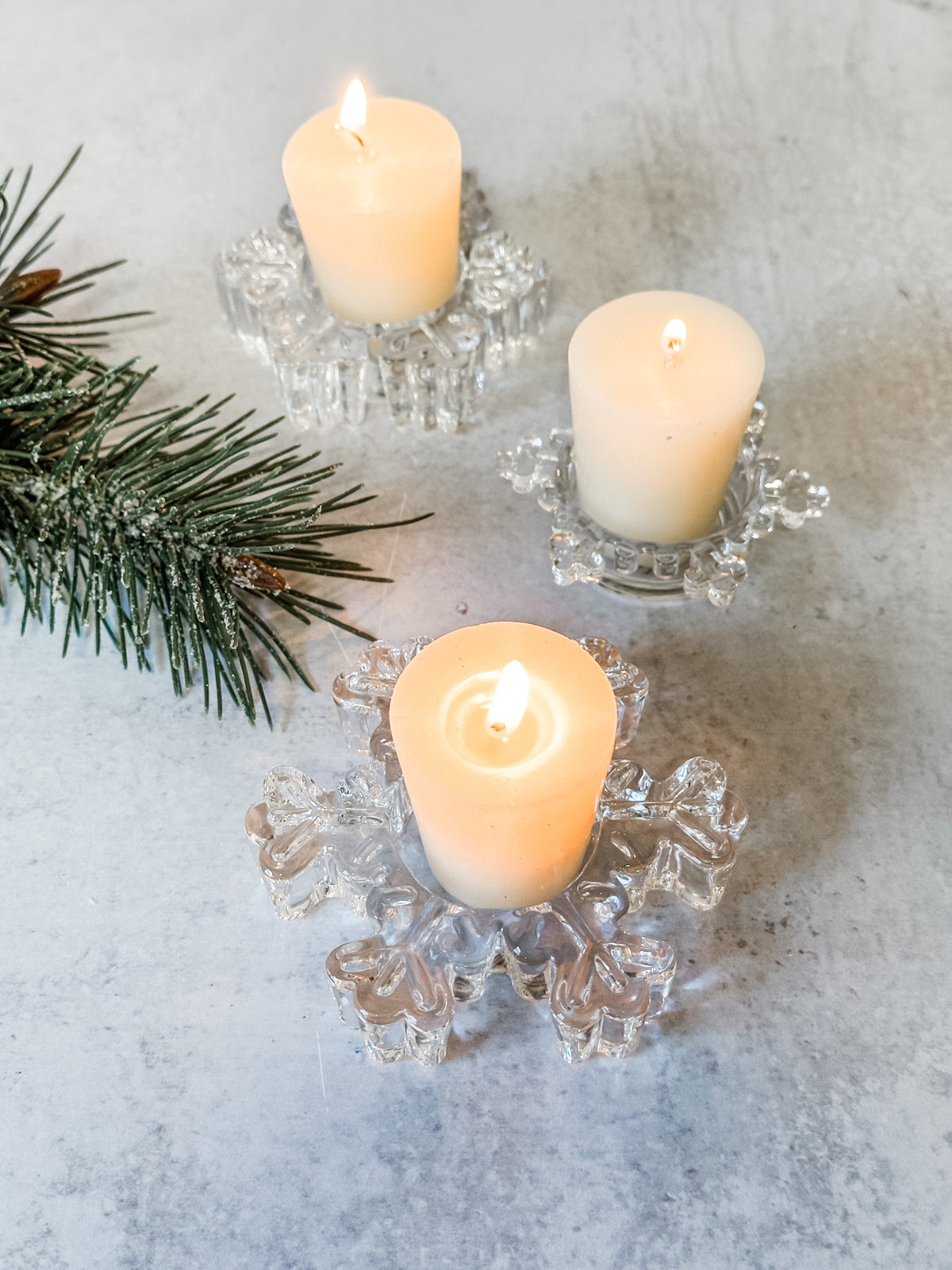 small glass snowflake shaped tealight holders at the rustic barn in killingworth ct