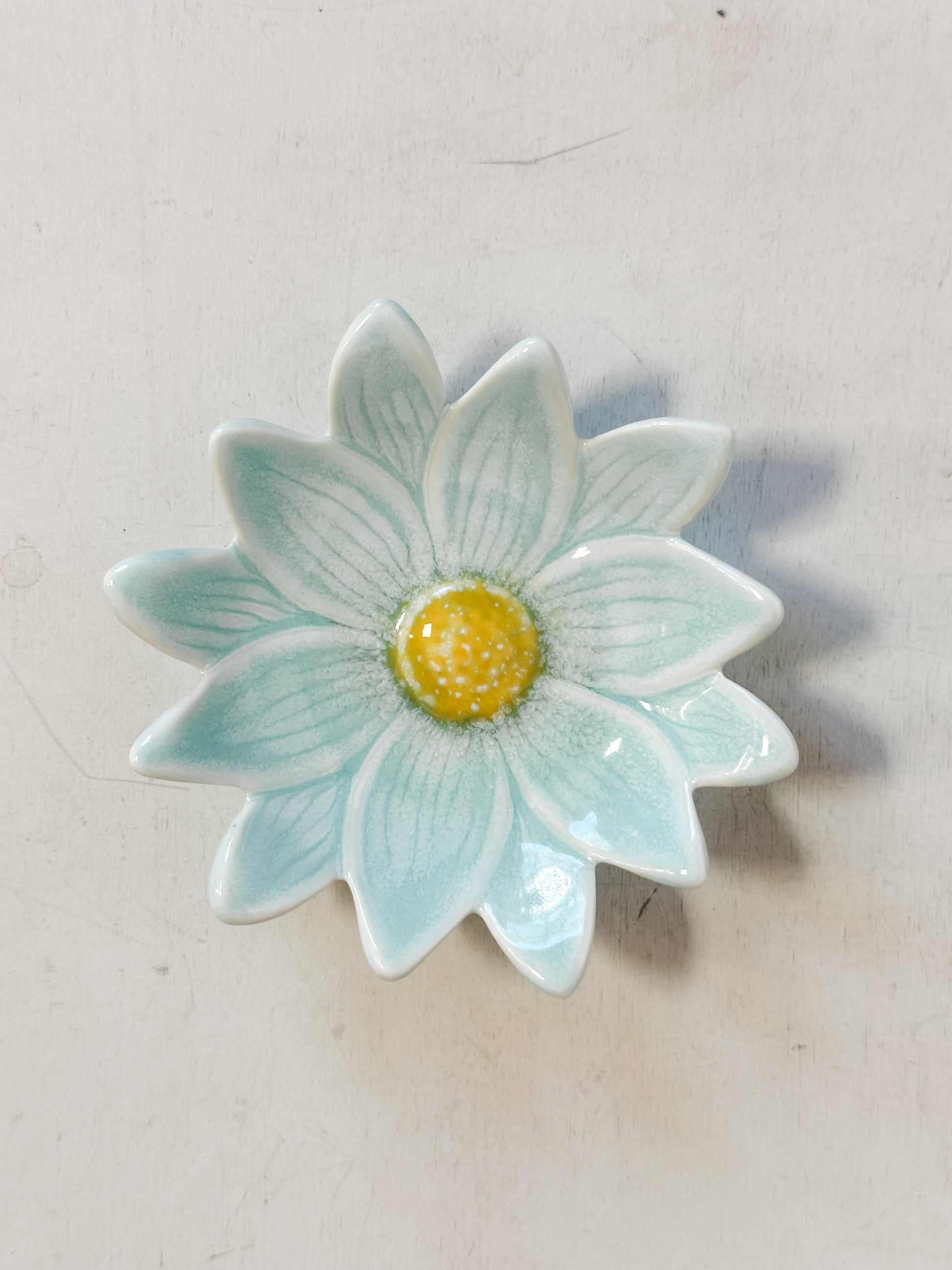 small teal stoneware flower shaped dishes at The Rustic Barn in Killingworth CT