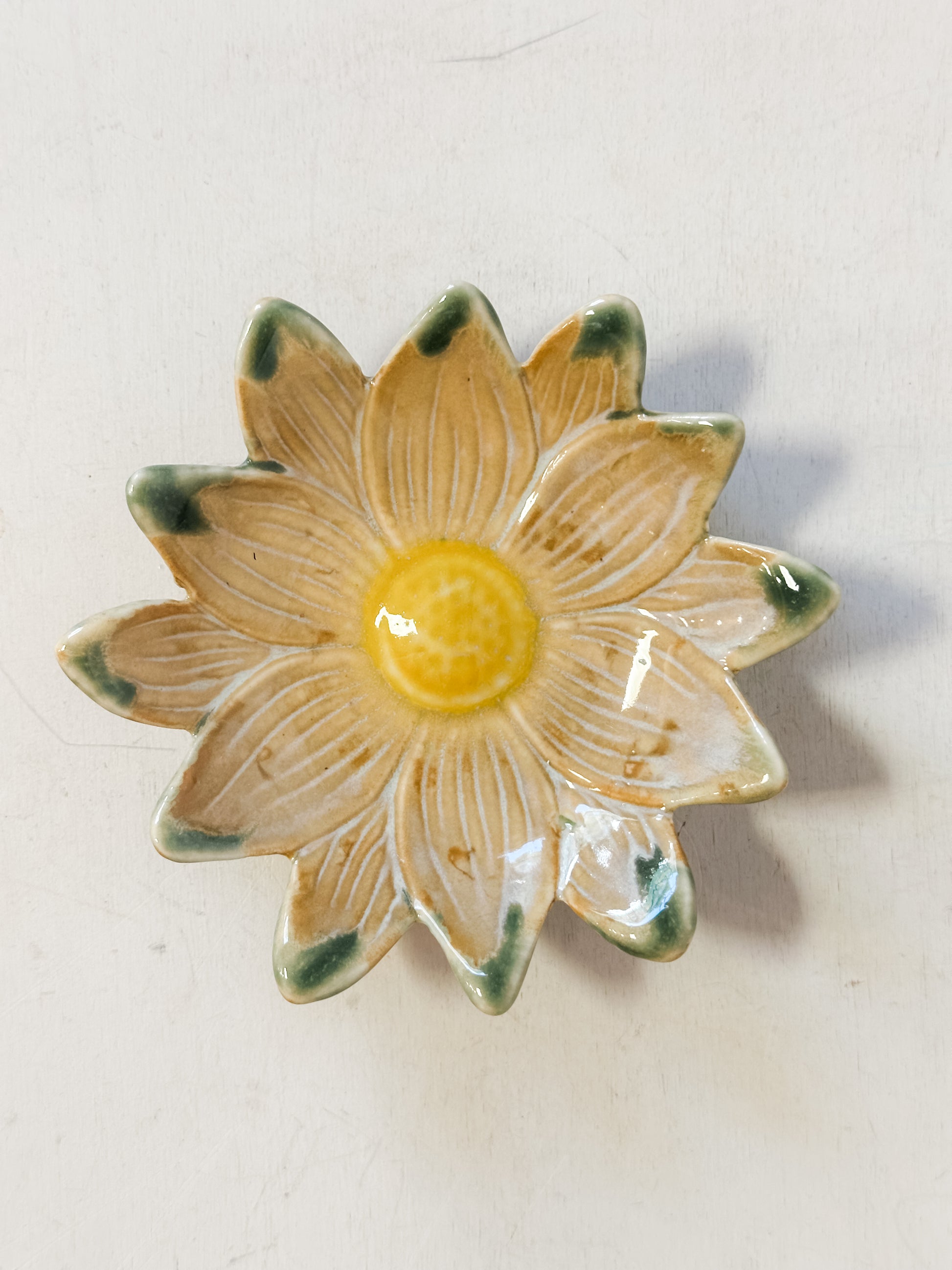 small yellow stoneware flower shaped dishes at The Rustic Barn in Killingworth CT