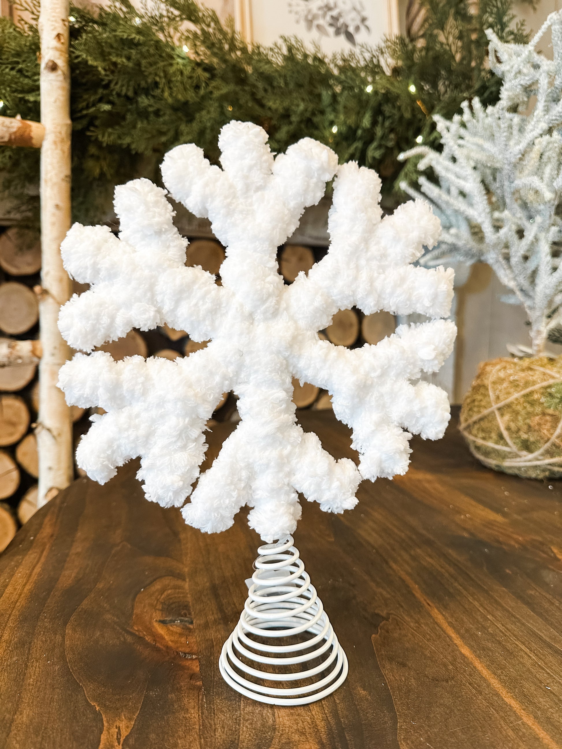 white snowflake tree topper at  The Rustic Barn in Killingworth CT