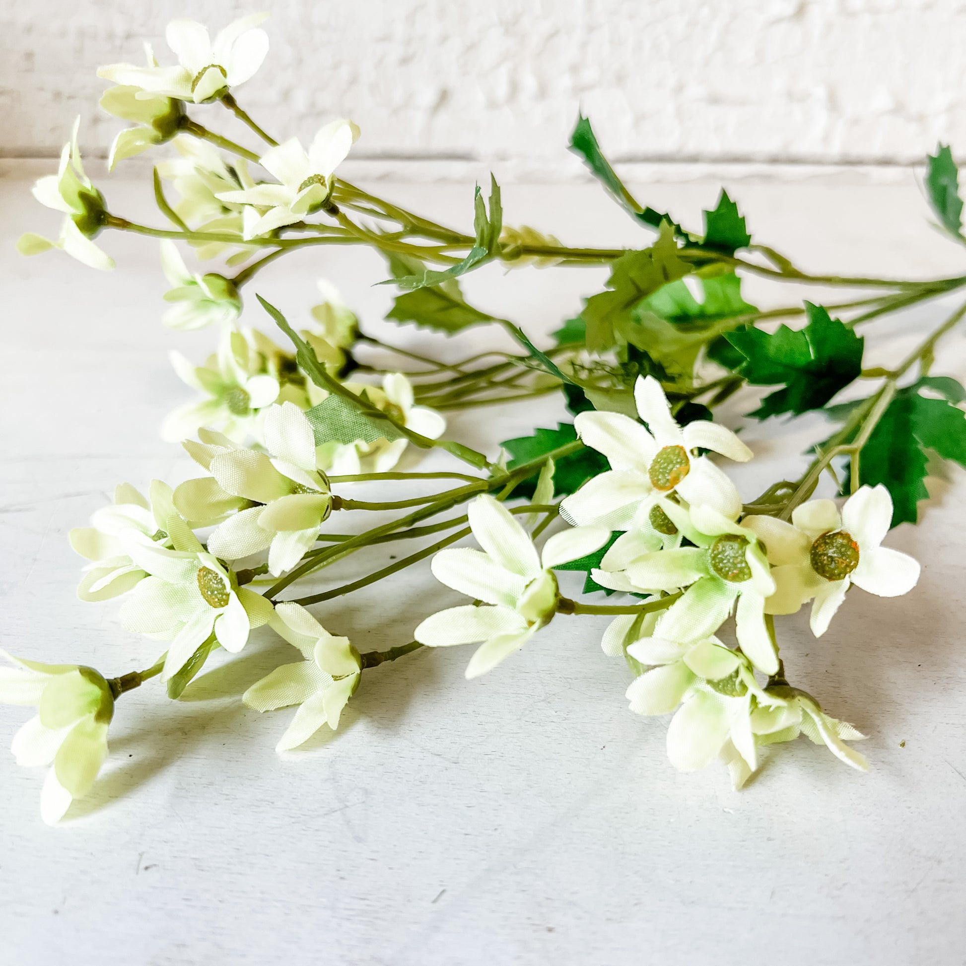 faux mini daisy stem at the rustic barn in killingworth ct