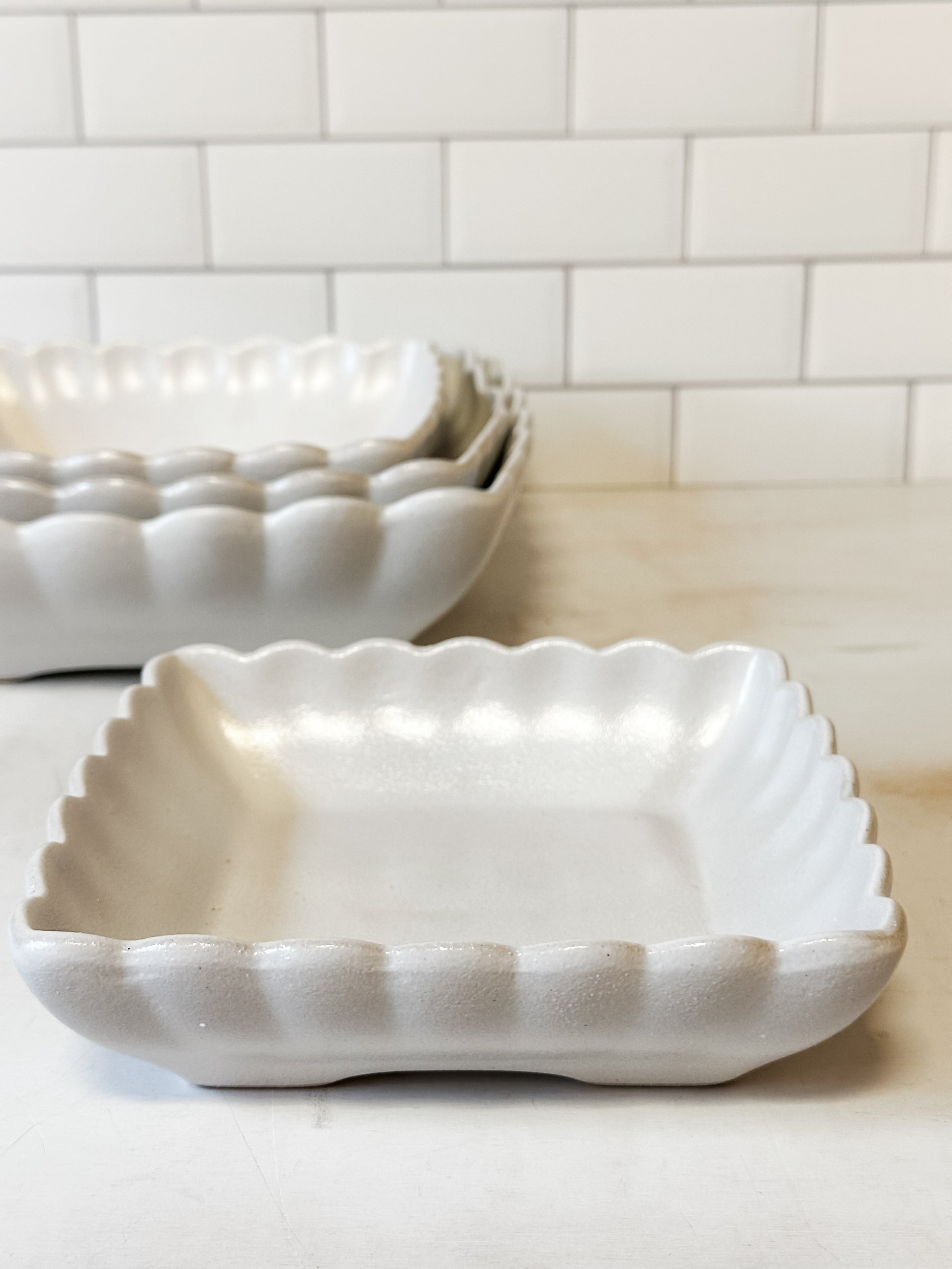 white square stoneware bowls with scalloped edge at The Rustic Barn in Killingworth CT