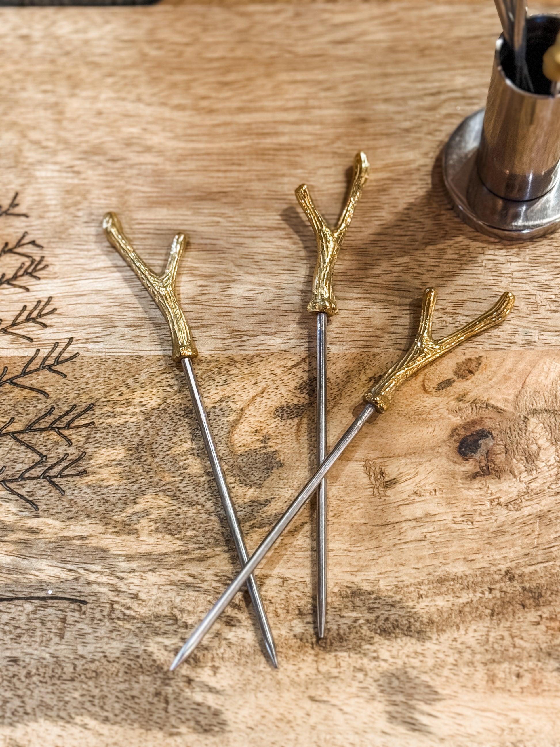 stainless steel holder and eight appetizer picks with brass antler handles at The Rustic Barn in Killingworth CT