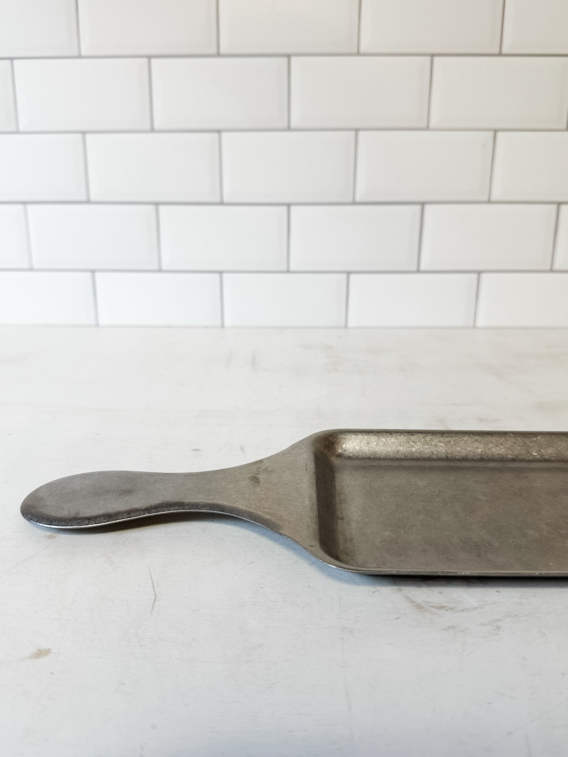 stainless steel serving tray with handle and brushed pewter finish at the Rustic Barn in Killingworth CT