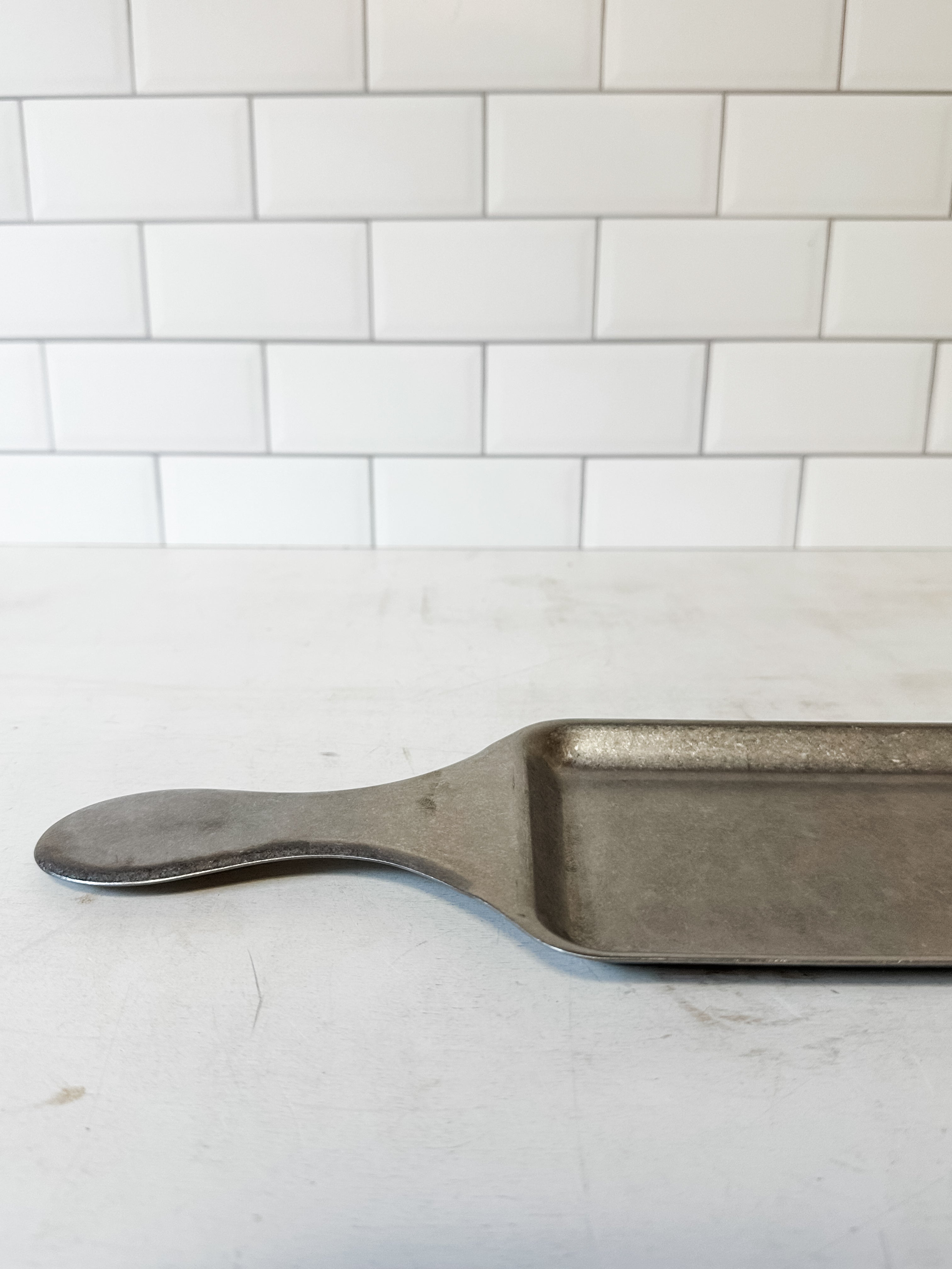 stainless steel serving tray with handle and brushed pewter finish at the Rustic Barn in Killingworth CT