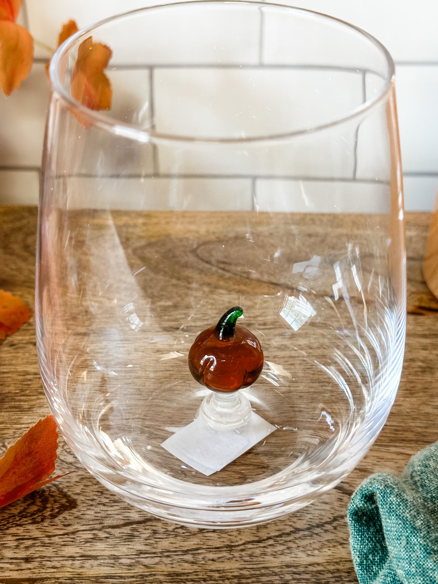 stemless wine glass with a pumpkin icon at the bottom at the rustic barn in killingworth ct