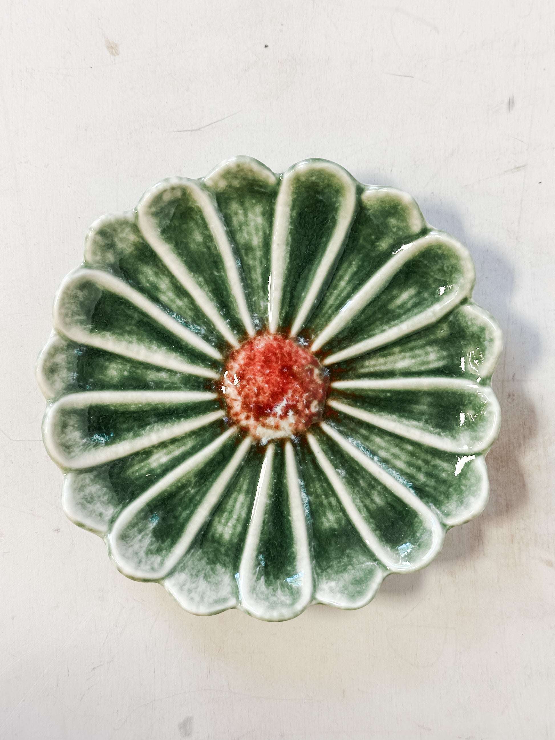 dark green stoneware flower shaped dishes at The Rustic Barn in Killingworth CT