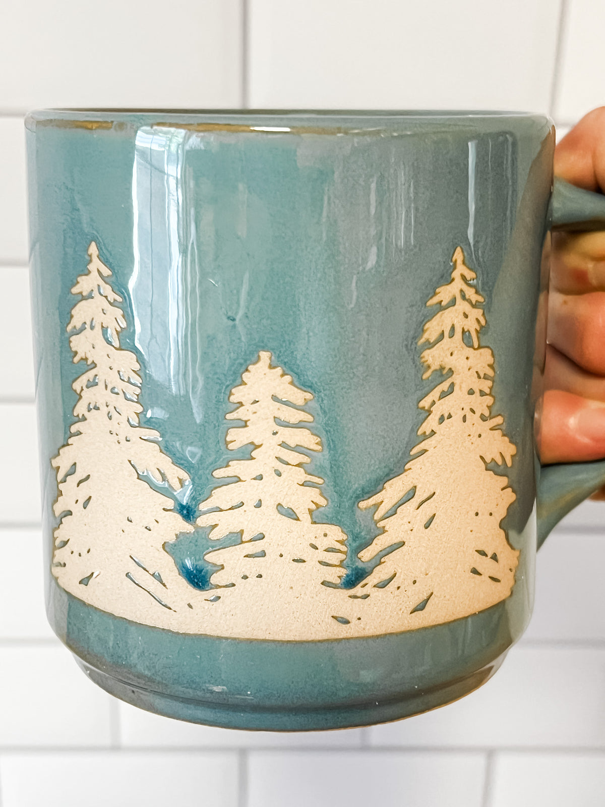 stoneware mug with wax relief trees blue color at the rustic barn in Killingworth ct