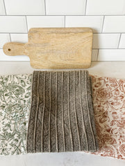 stonewashed cotton tea towels and mango wood serving board set at the Rustic Barn in Killingworth, CT
