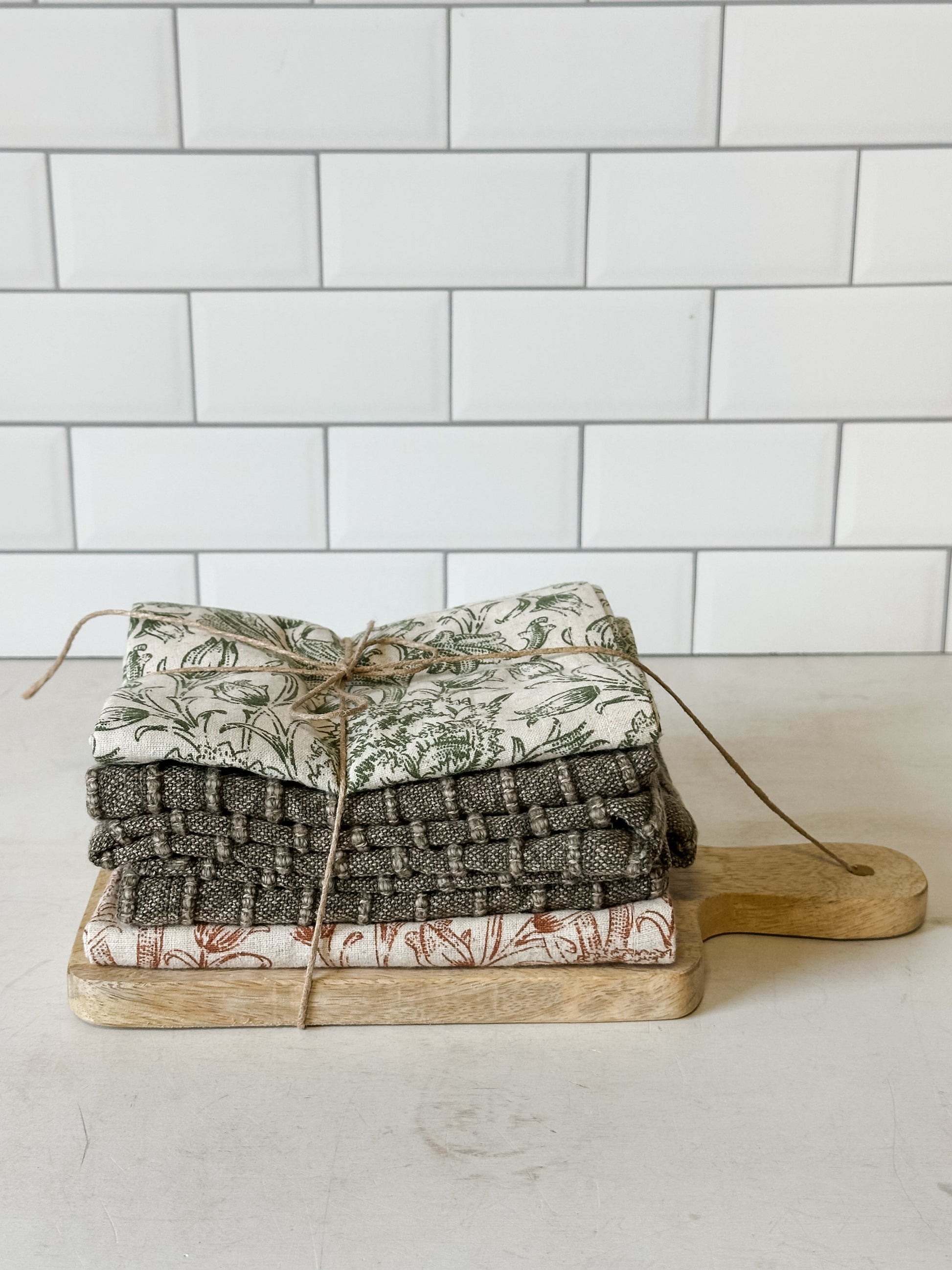 stonewashed cotton tea towels and mango wood serving board set at the Rustic Barn in Killingworth, CT