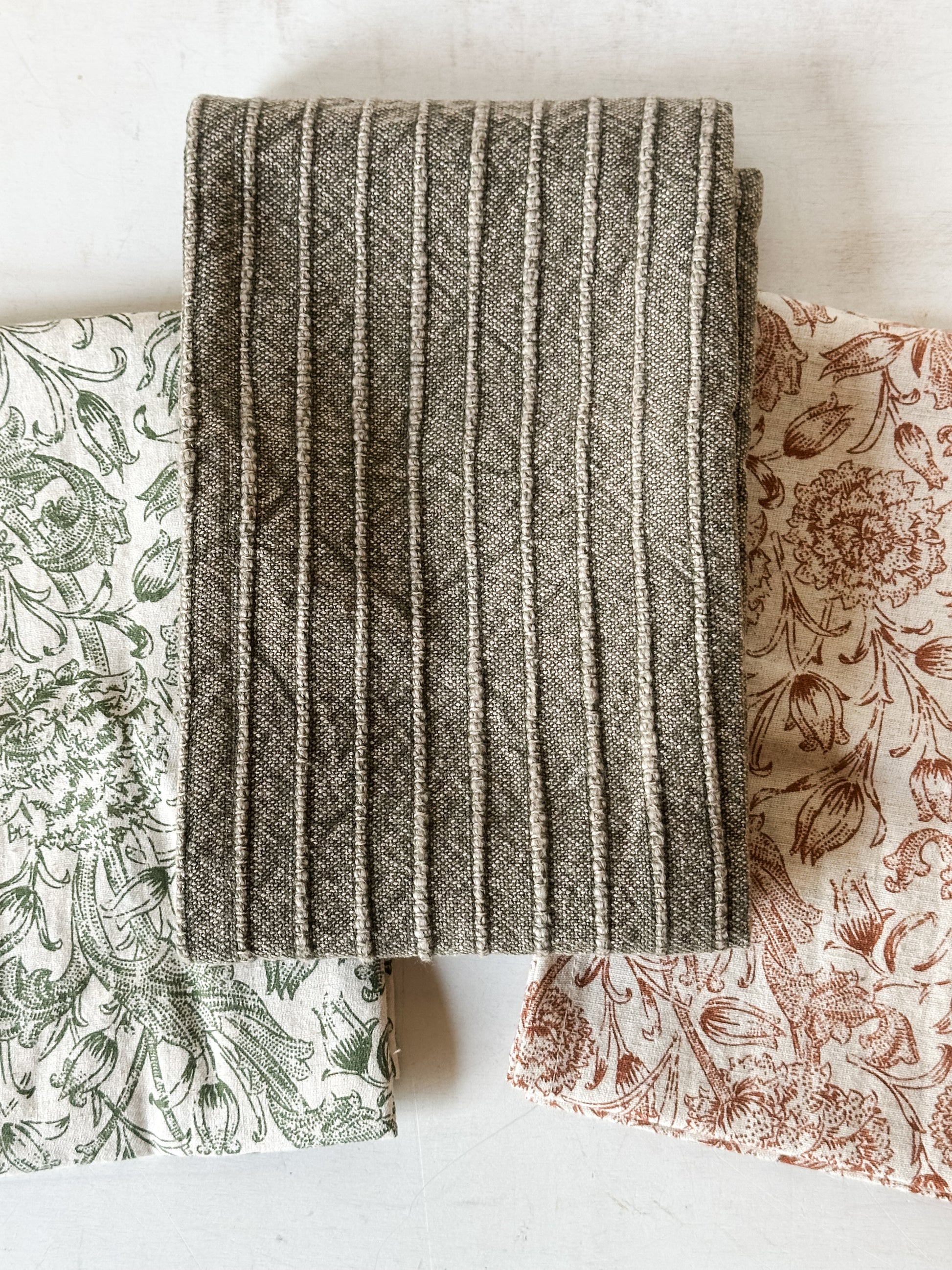 stonewashed cotton tea towels and mango wood serving board set at the Rustic Barn in Killingworth, CT