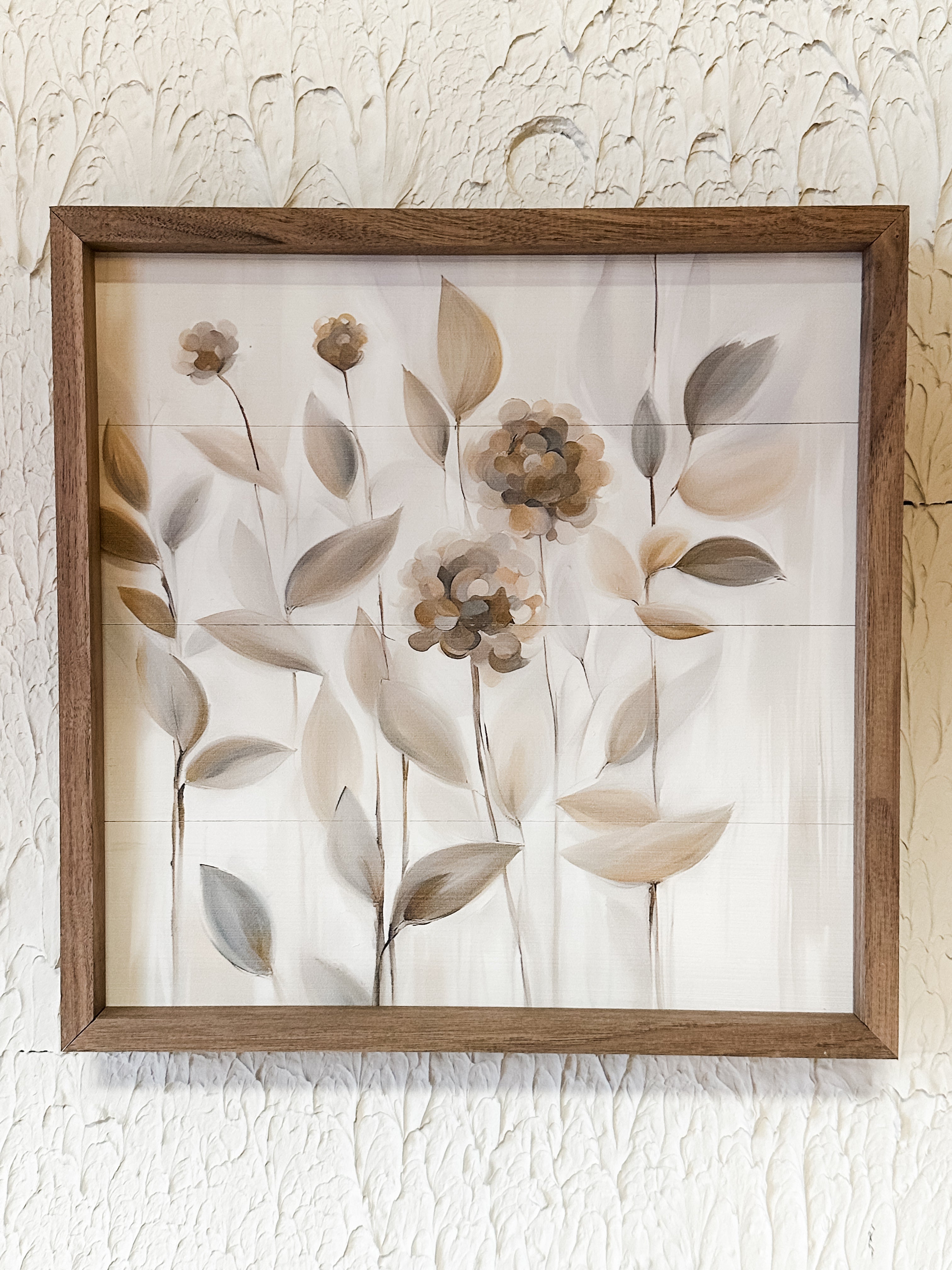 tan flowers wooden wall decor at the Rustic Barn in Killingworth, CT