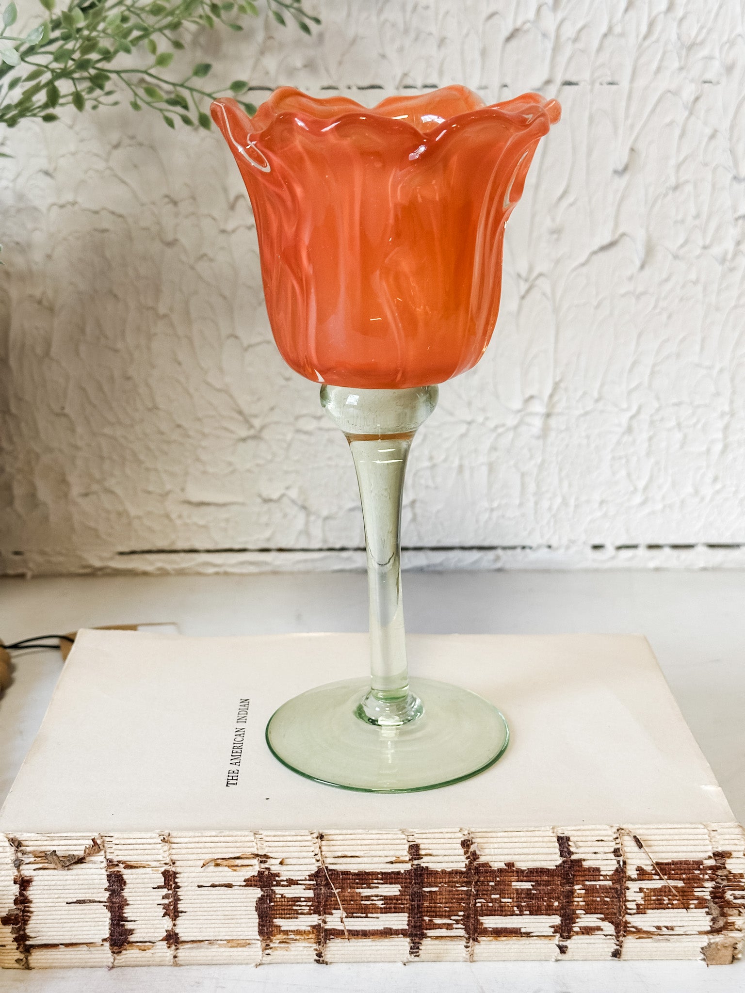 vibrant orange glass tulip votive holder at the rustic barn in killingworth ct