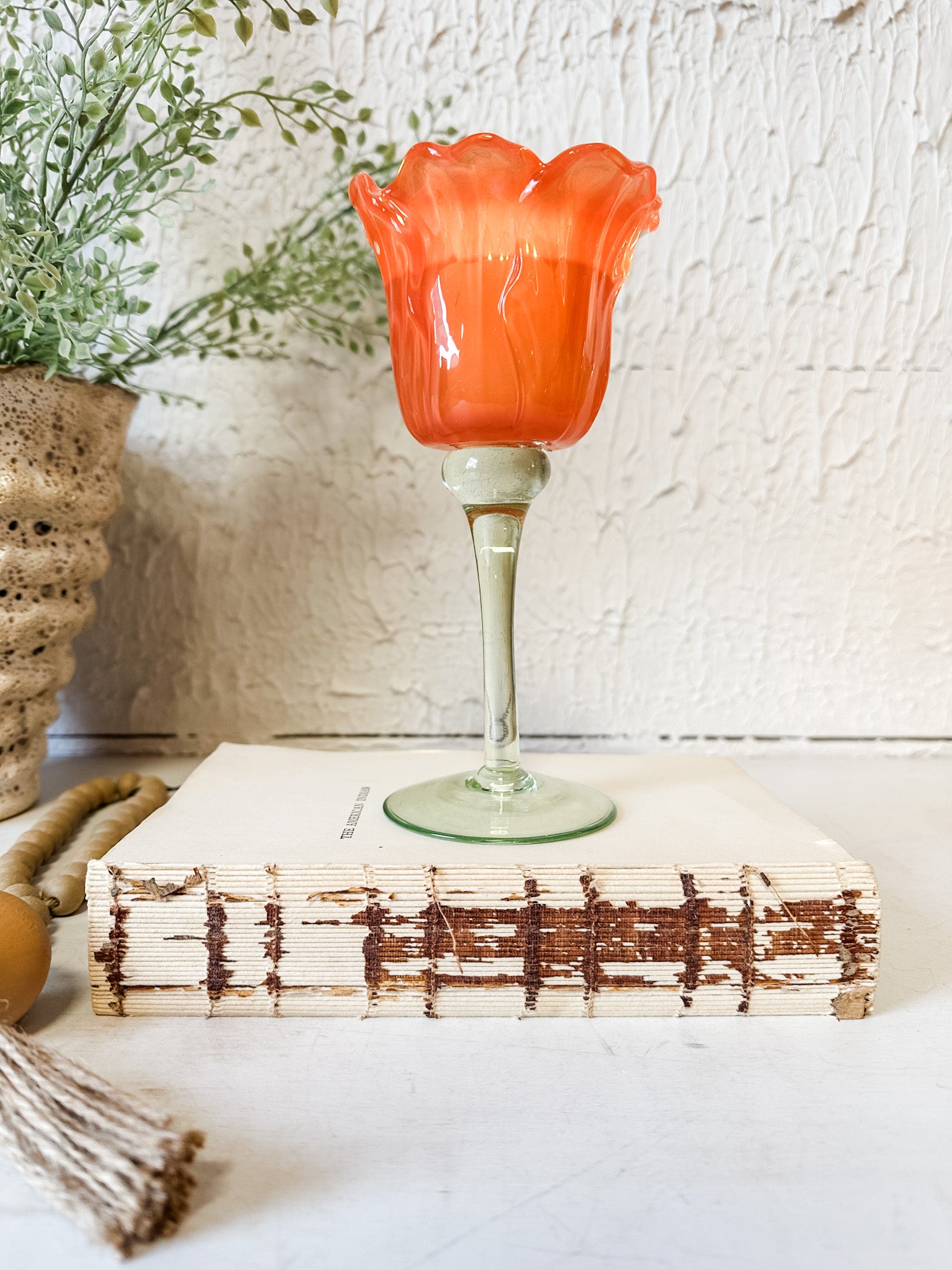 vibrant orange glass tulip votive holder at the rustic barn in killingworth ct