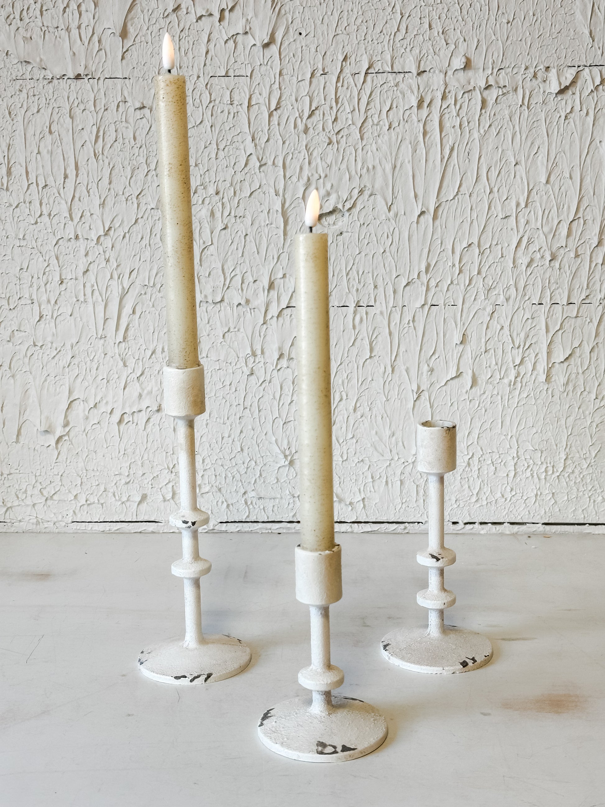 vintage aged white taper candle holders in 3 sizes at the rustic barn in killingworth ct