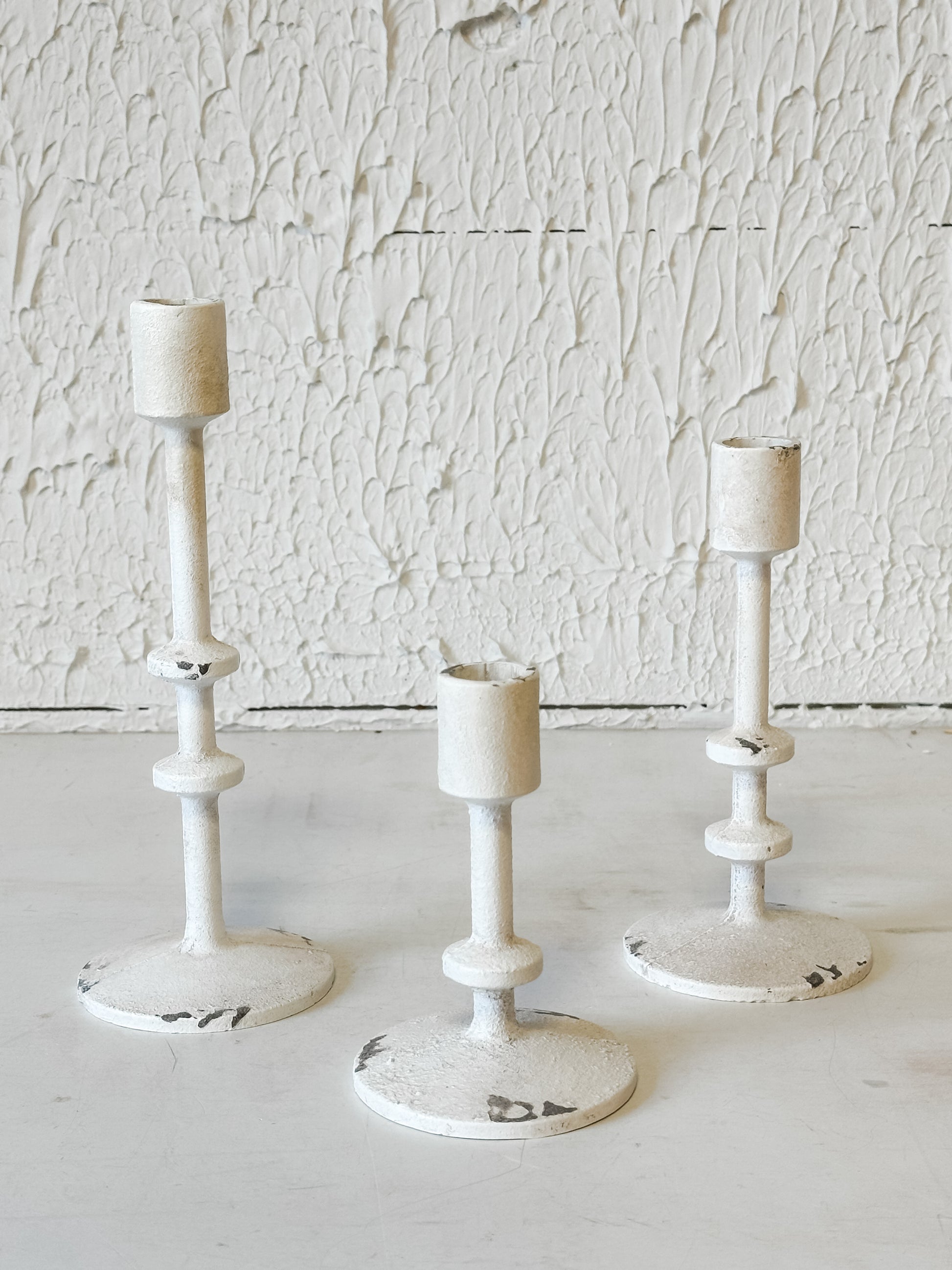 vintage aged white taper candle holders in 3 sizes at the rustic barn in killingworth ct