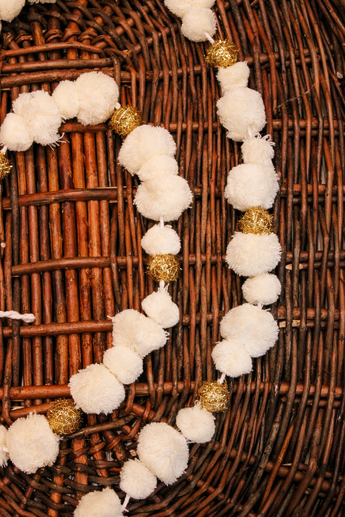 white and gold pom pom garland for christmas for sale at the rustic barn in killingworth, CT