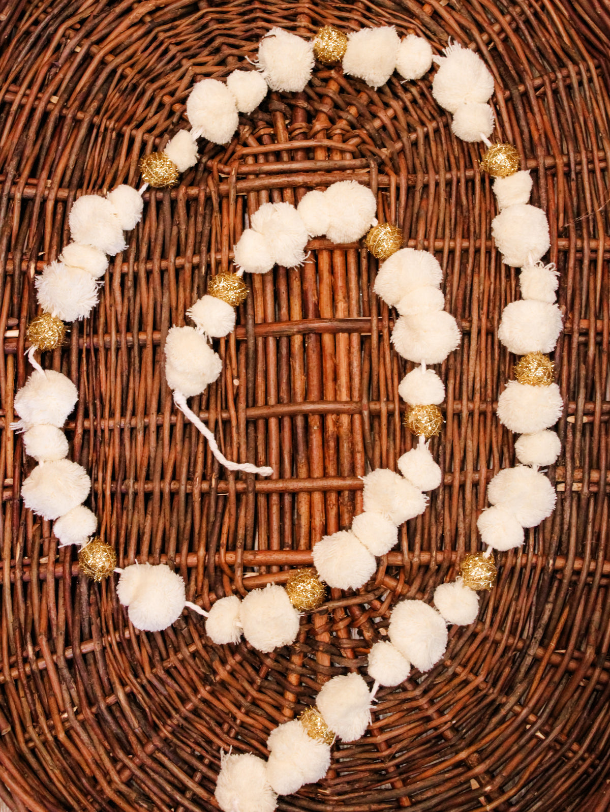 white and gold pom pom garland for christmas for sale at the rustic barn in killingworth, CT